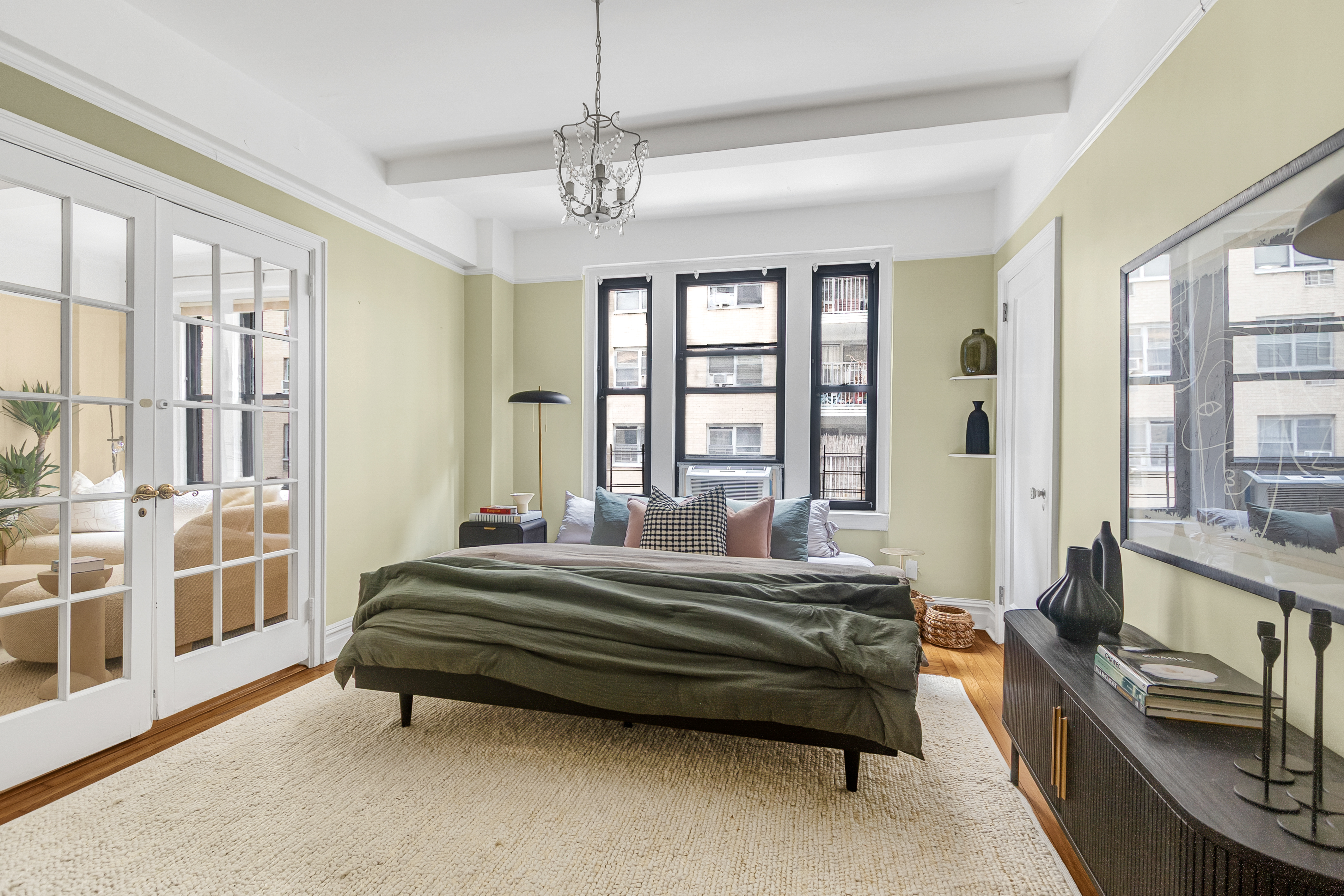 41 West 96th Street, Unit 4C Manhattan, NY 10025 - Photo 8 of 14 a spacious bedroom with a bed and a large window