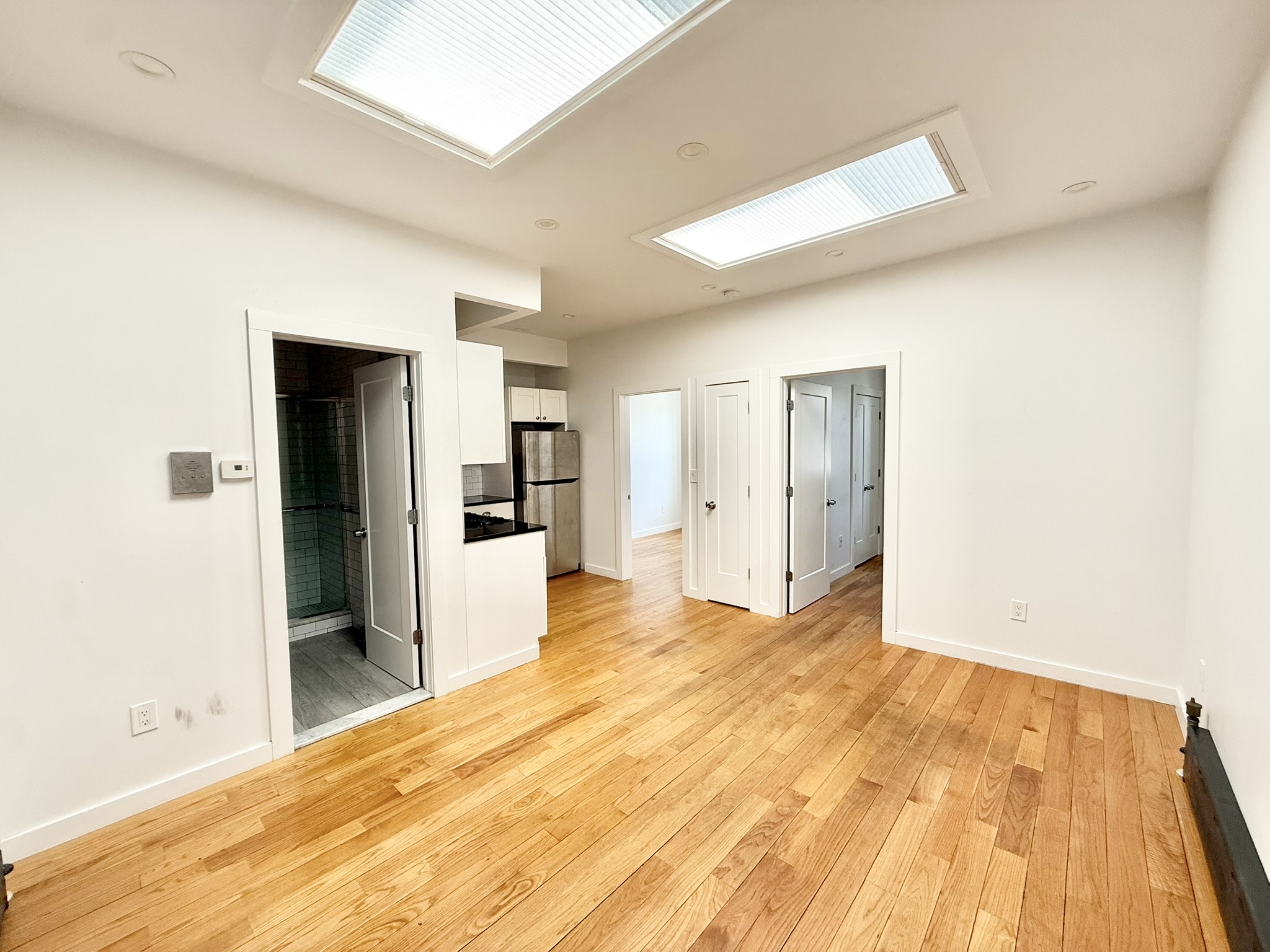 2013 Flatbush Avenue, Unit 2R Brooklyn, NY 11234 - Photo 10 of 11 a view of an empty room with wooden floor