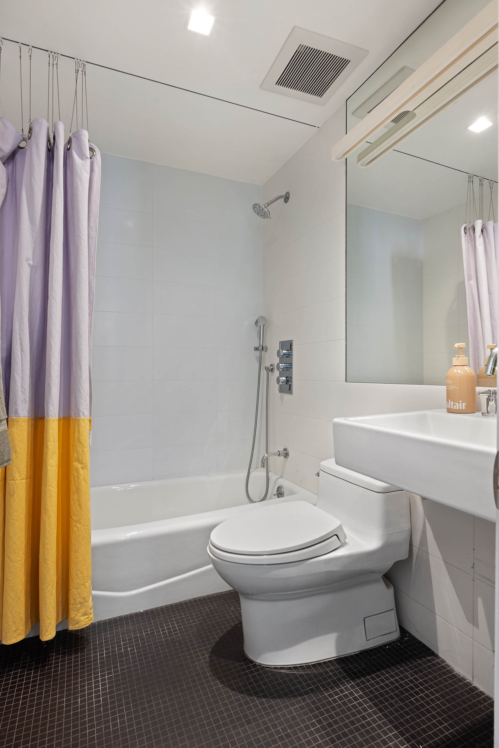 148 Warren Street Brooklyn, NY 11201 - Photo 15 of 20 a bathroom with a sink and a shower