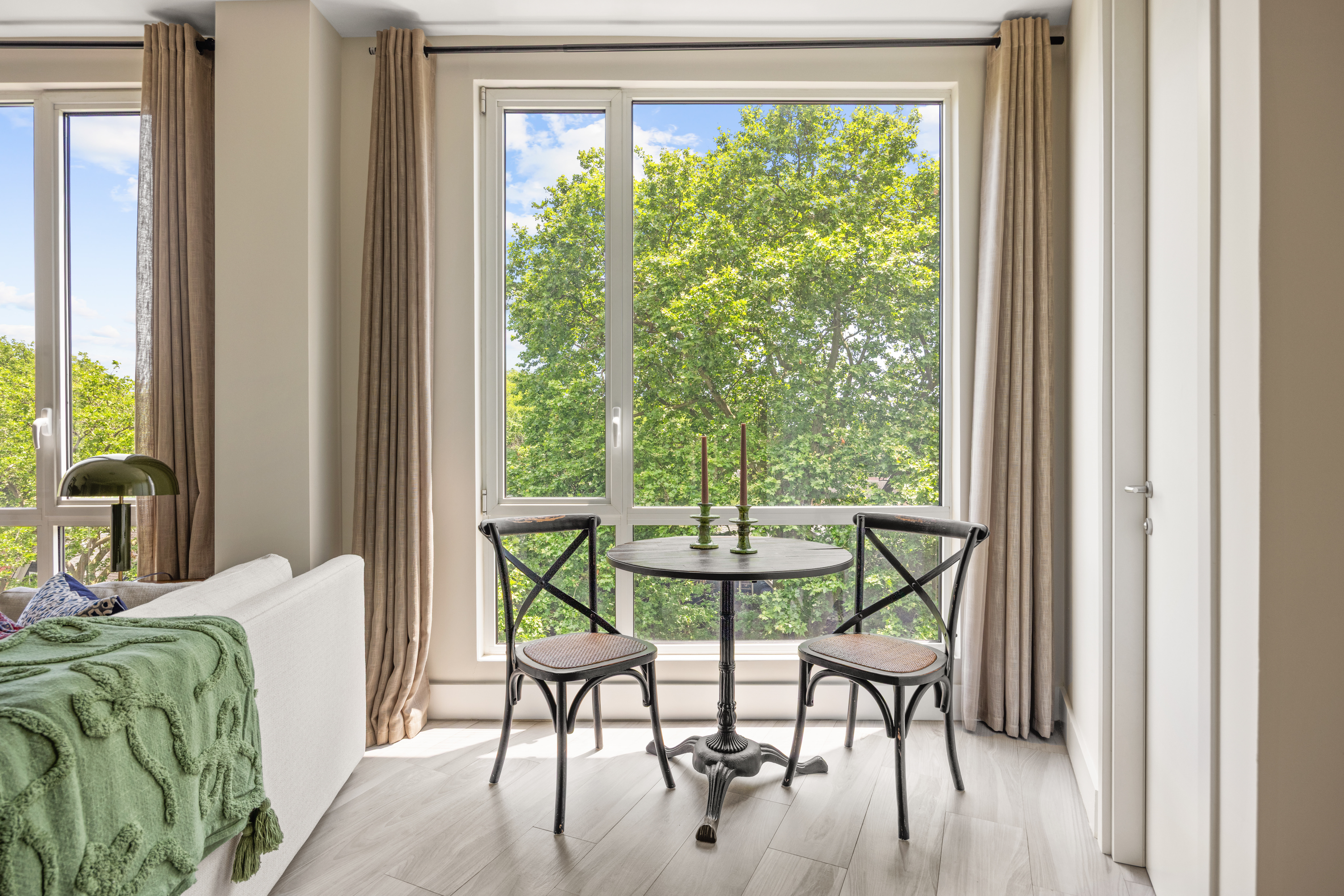 631 East 18th Street, Unit 5C Brooklyn, NY 11226 - Photo 3 of 8 a view of a dining room with furniture window and outside view