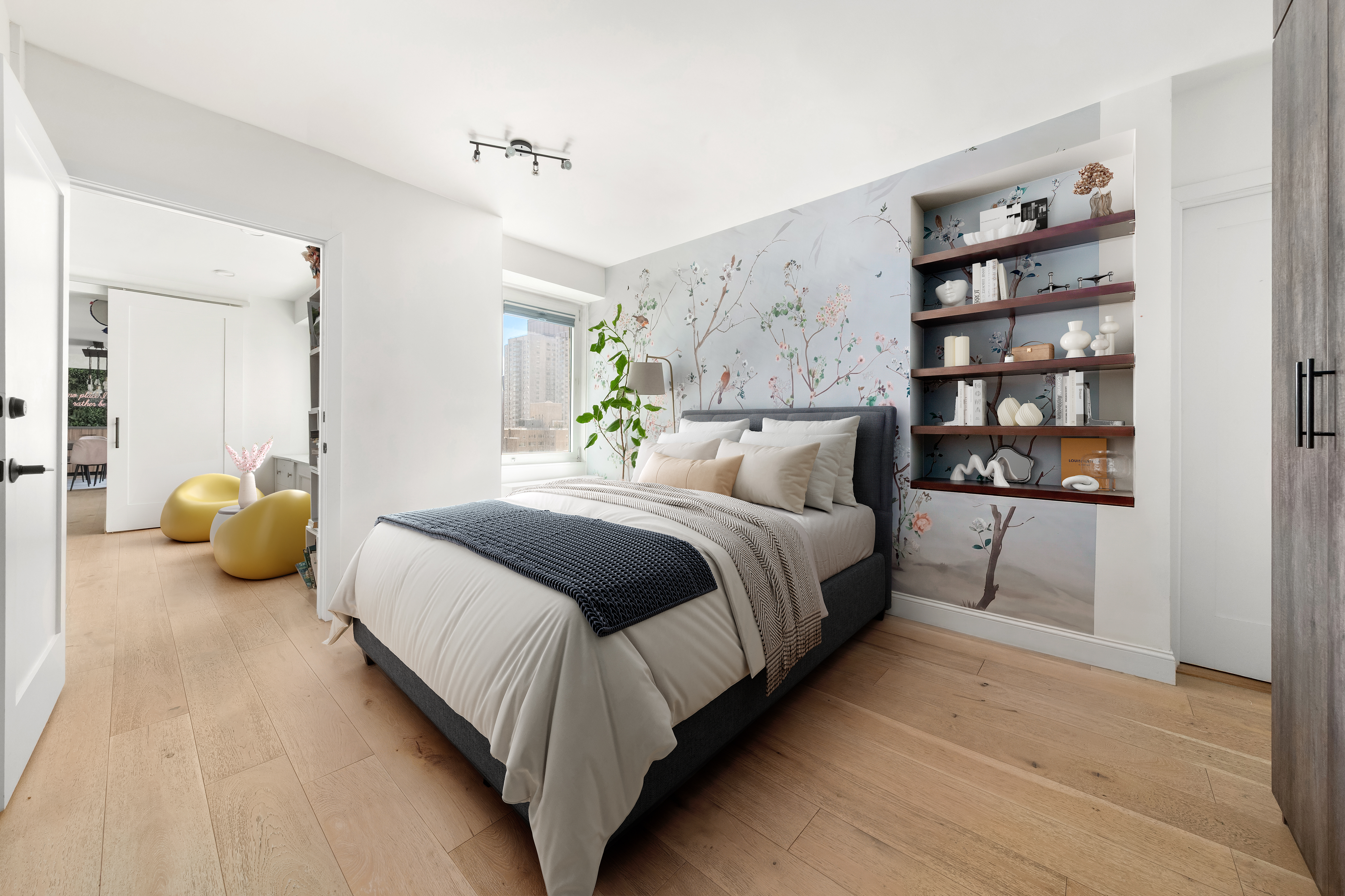 303 East 57th Street, Unit 20LA Manhattan, NY 10022 - Photo 11 of 16 a bedroom with a bed and walk in closet