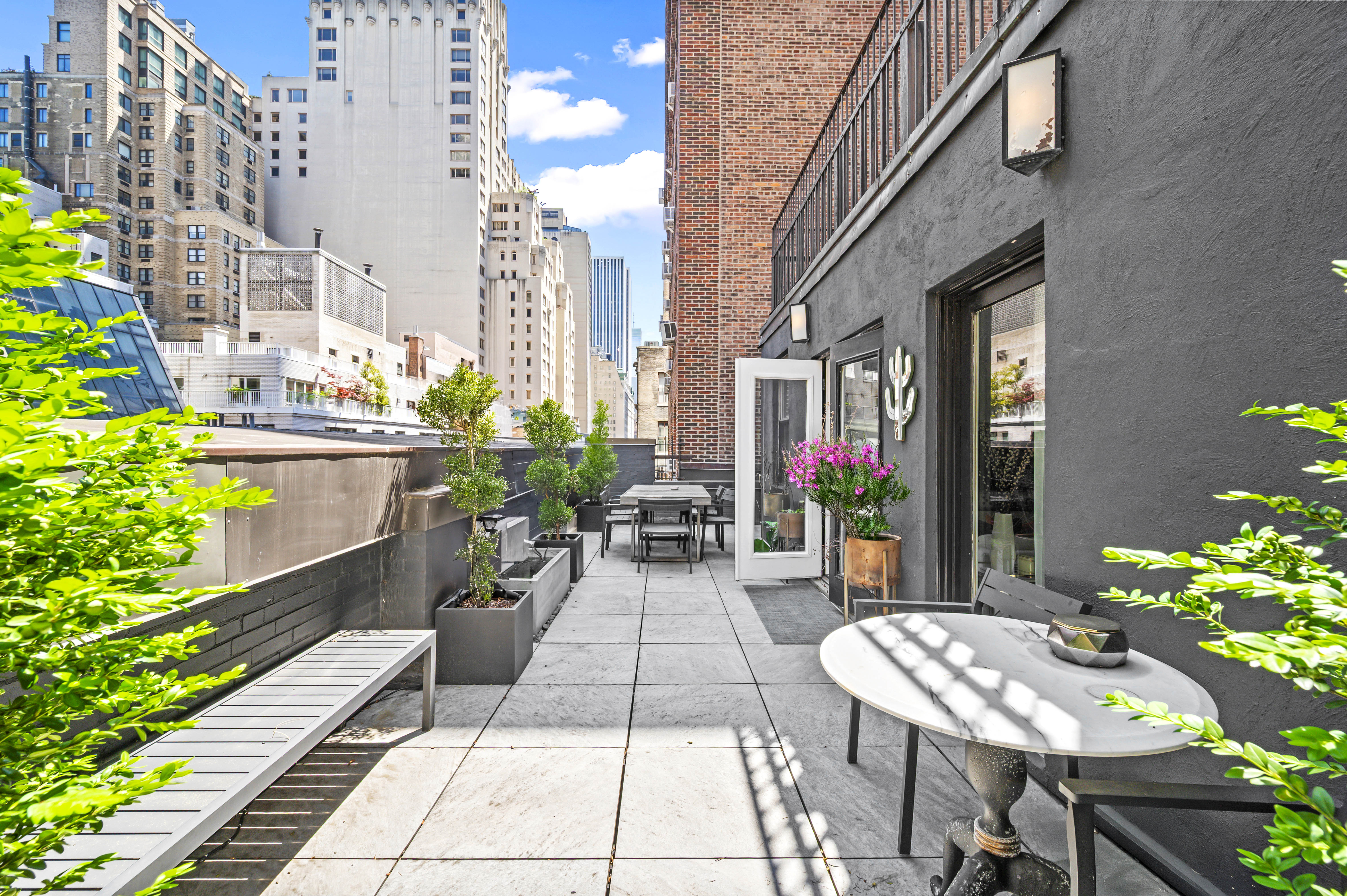 140 West 58th Street, Unit PHA Manhattan, NY 10019 - Photo 6 of 13 a view of a patio with sitting area