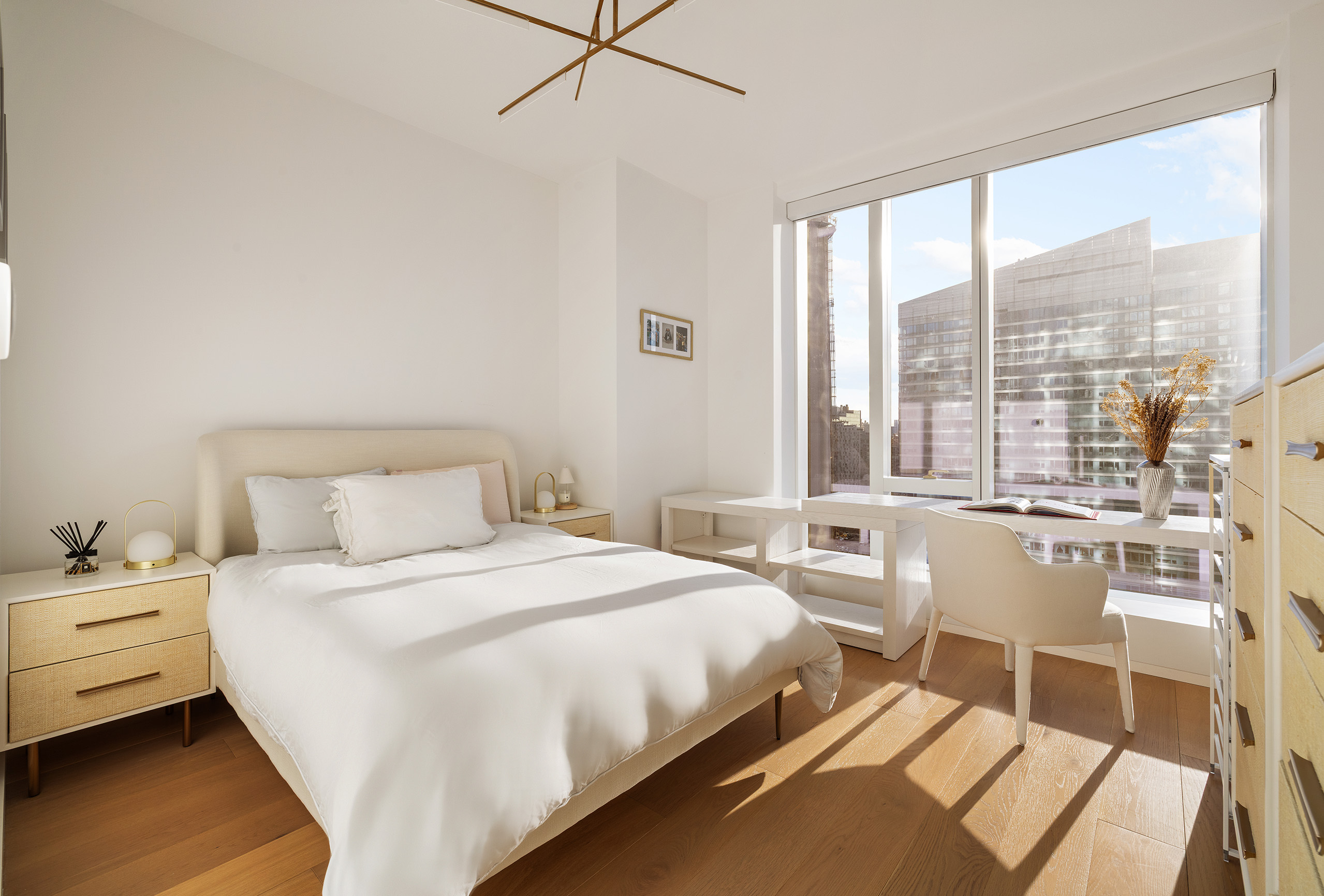 1 West End Avenue, Unit 25F Manhattan, NY 10023 - Photo 8 of 15 a bedroom with a bed and a large window