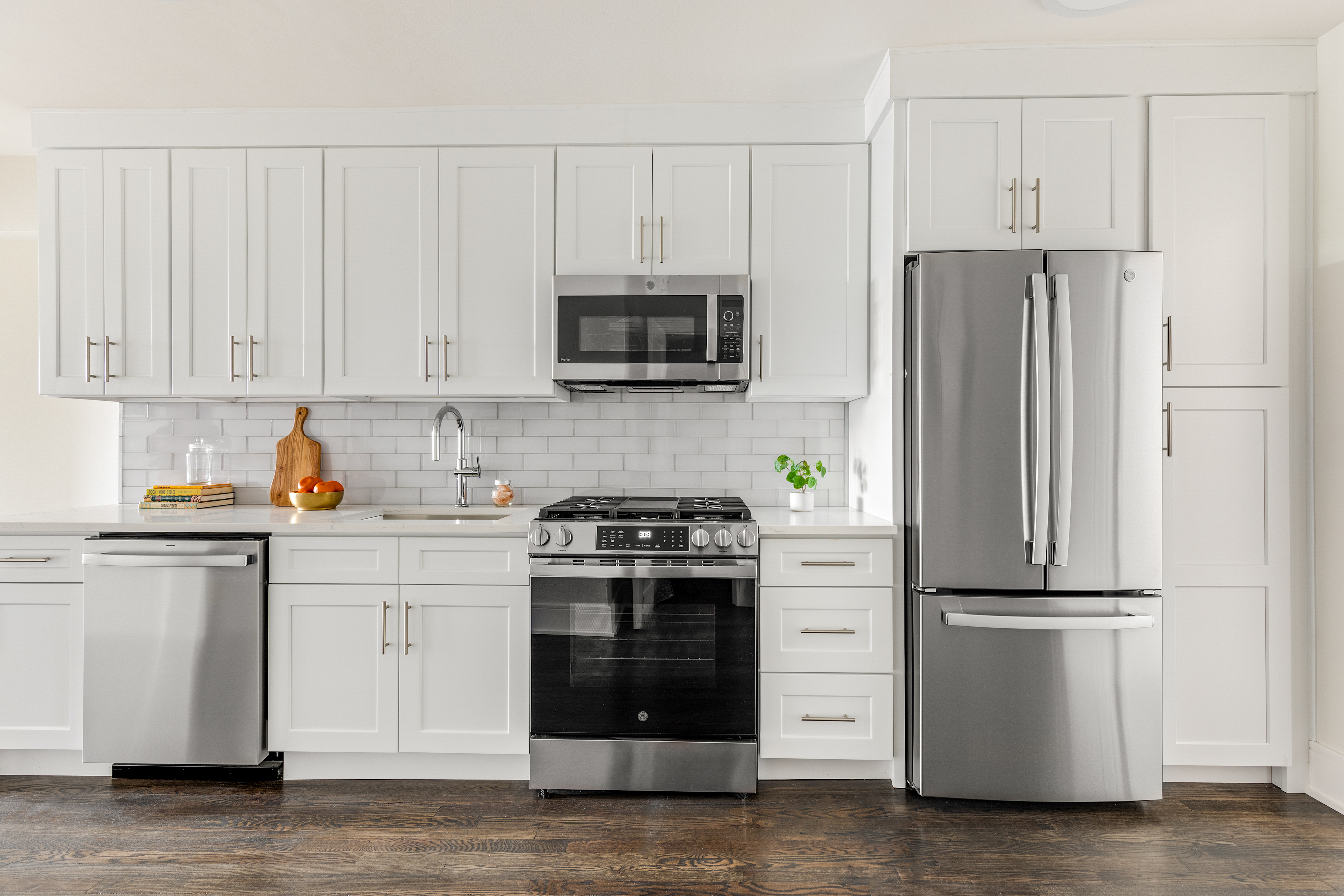 160 Ocean Parkway, Unit 6C Brooklyn, NY 11218 - Photo 4 of 9 a kitchen with cabinets stainless steel appliances and wooden floor