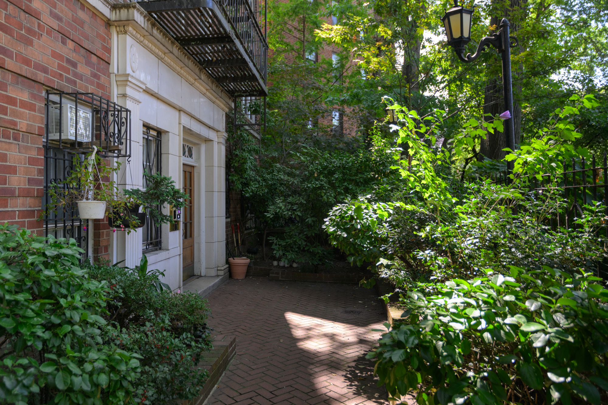 25 Minetta Lane, Unit 6G Manhattan, NY 10012 - Photo 12 of 13 a view of a pathway that has plants and flowers