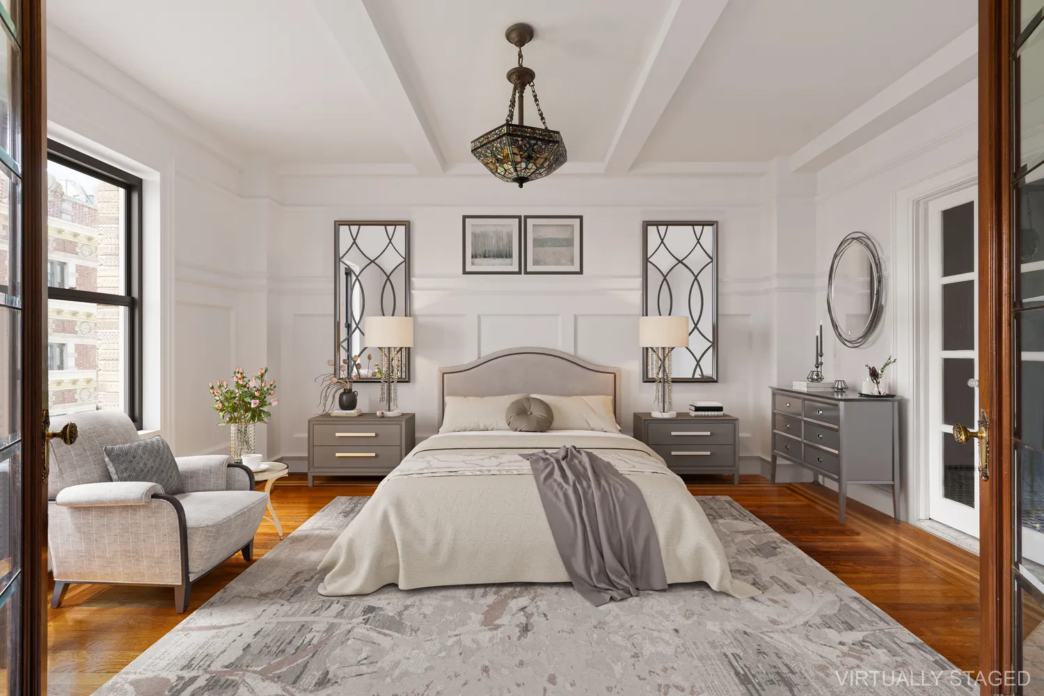 a bedroom with a large bed and windows