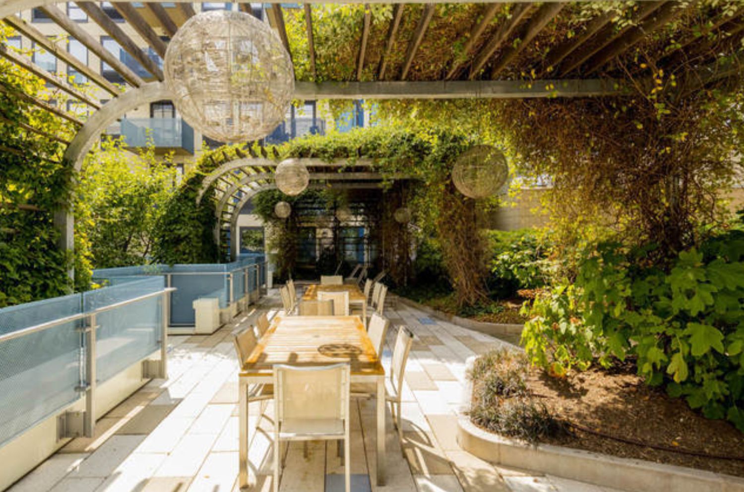 454 West 54th Street, Unit PHC Manhattan, NY 10019 - Photo 17 of 27 a view of a patio with table and chairs potted plants