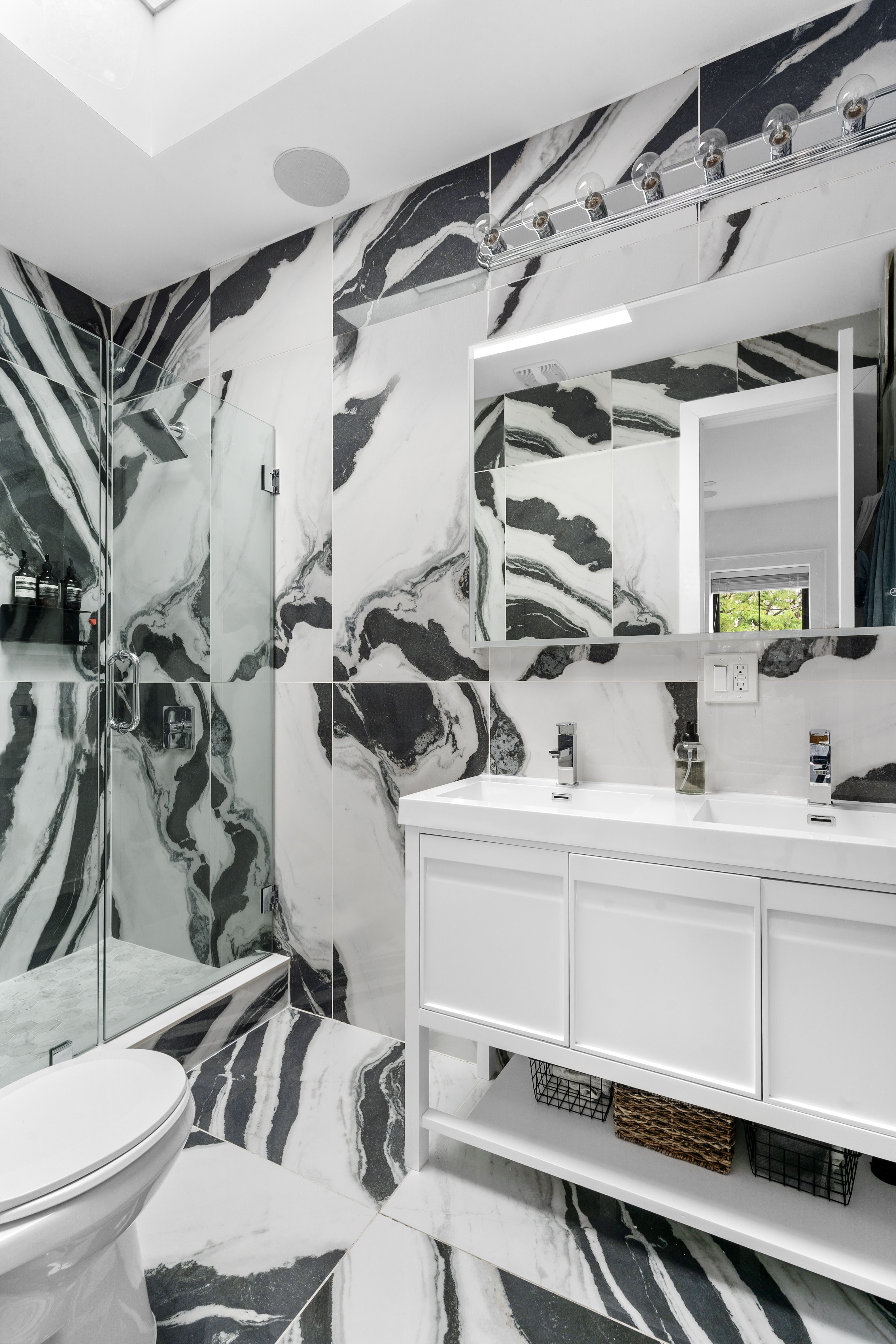 1591 Pacific Street Brooklyn, NY 11213 - Photo 9 of 16 a kitchen with a sink a mirror and cabinets