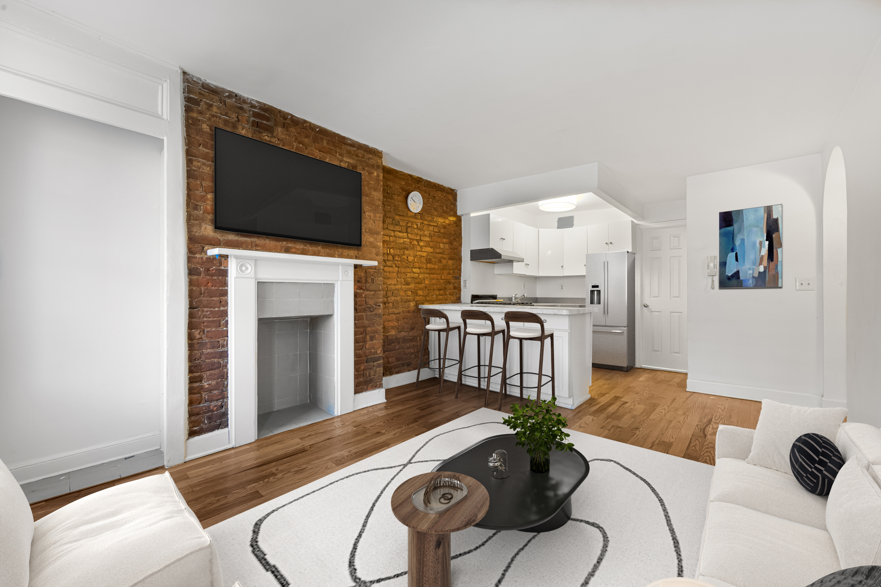 504 East 6th Street, Unit 6 Manhattan, NY 10009 - Photo 2 of 19 a living room with furniture fireplace and flat screen tv