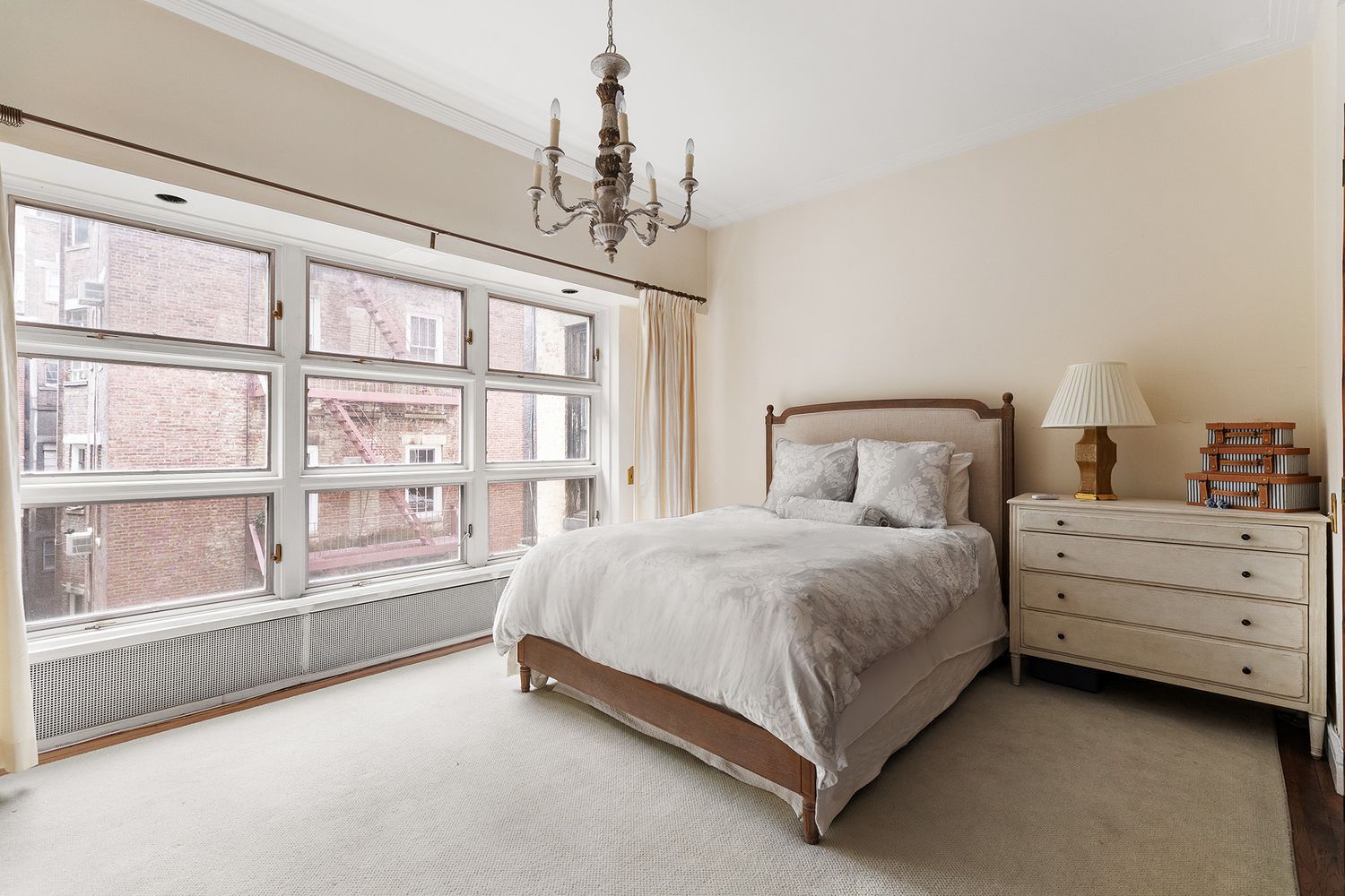60 East 79th Street, Unit 3B Manhattan, NY 10075 - Photo 3 of 8 a spacious bedroom with a bed and a window