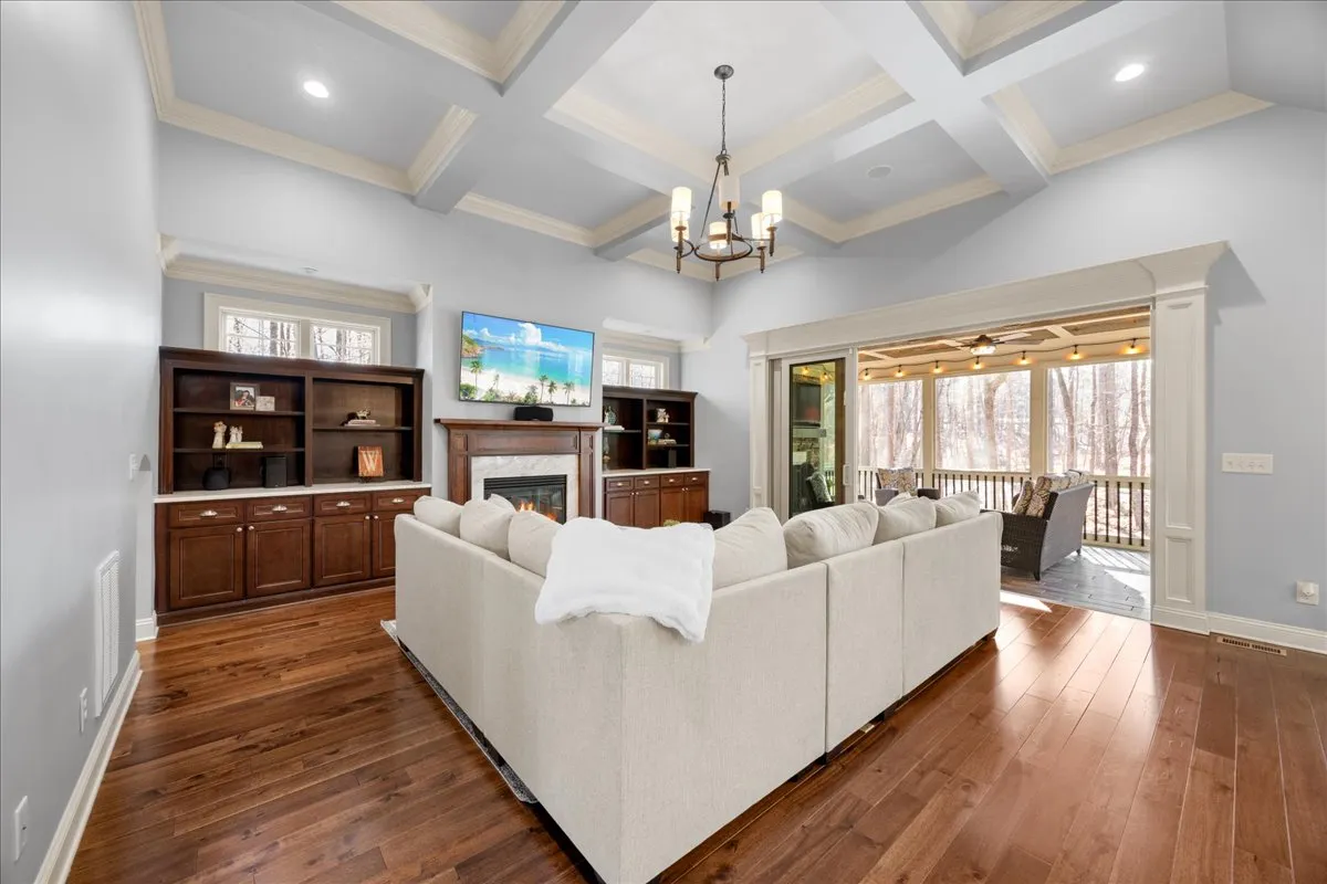 a kitchen with stainless steel appliances granite countertop a sink a stove and a wooden floors