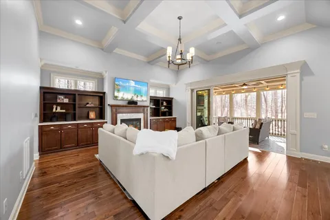 a kitchen with stainless steel appliances granite countertop a sink a stove and a wooden floors