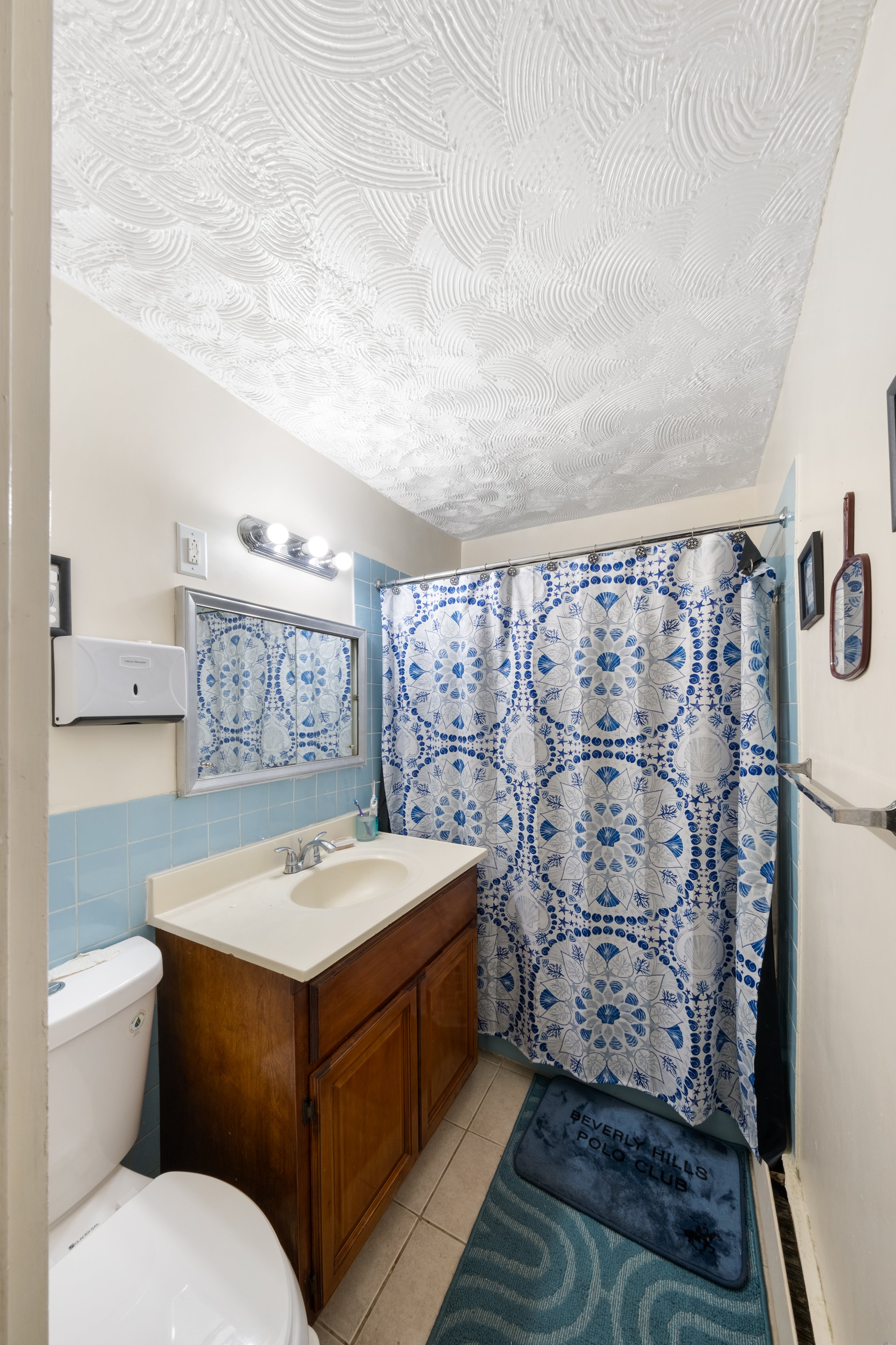 1464 East 84th Street Brooklyn, NY 11236 - Photo 7 of 22 a bathroom with a sink toilet and shower