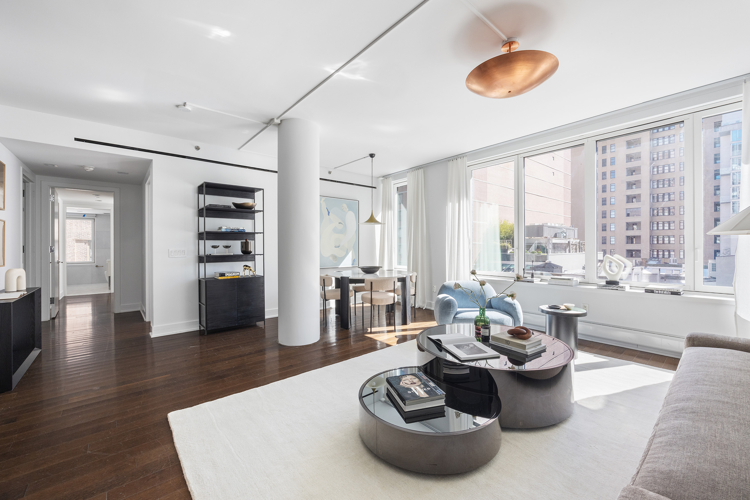 5 Franklin Place, Unit 9D Manhattan, NY 10013 - Photo 3 of 20 a living room with furniture and a large window