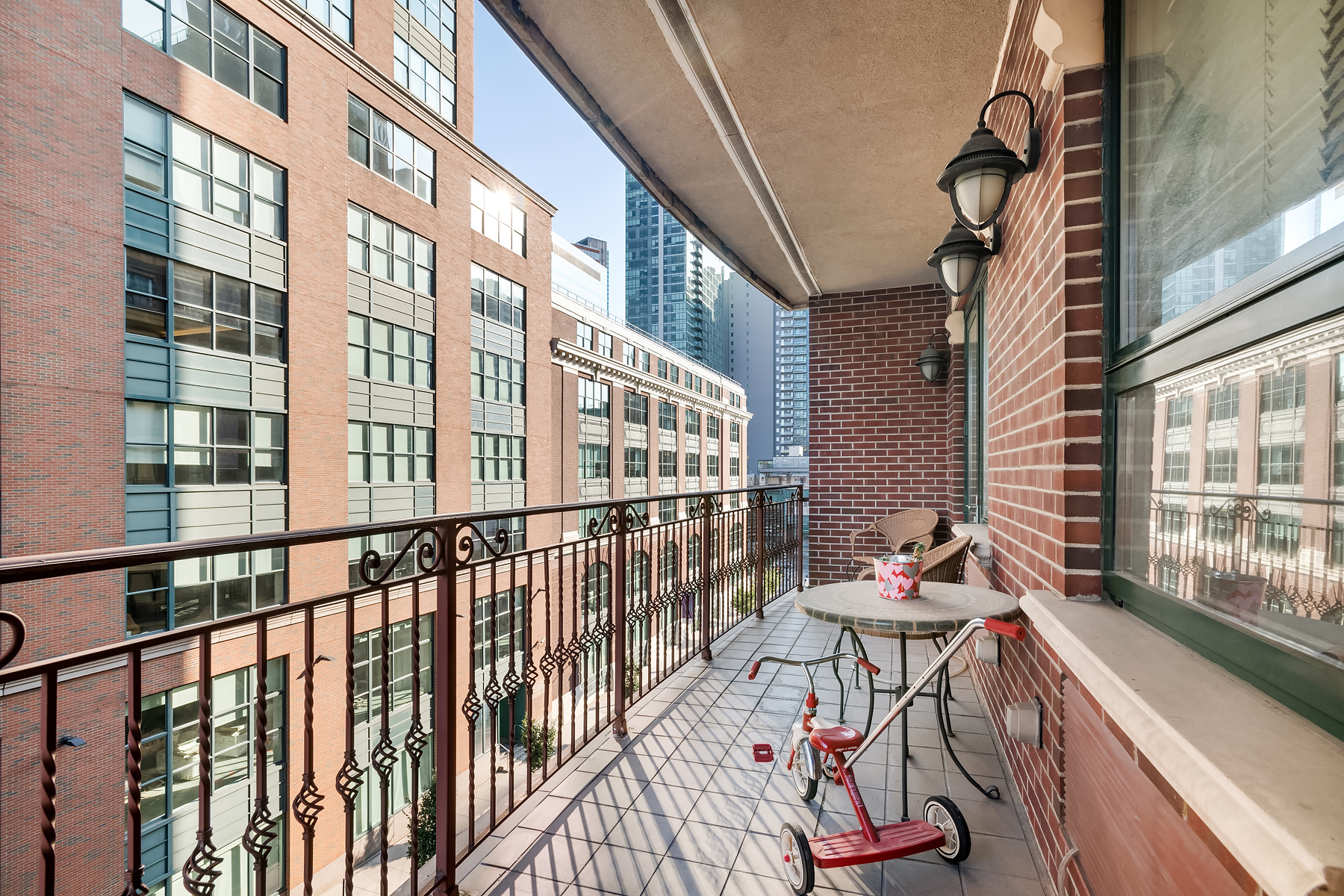 41-26 27th Street, Unit 5E Queens, NY 11101 - Photo 10 of 12 a view of a chairs and table in the balcony