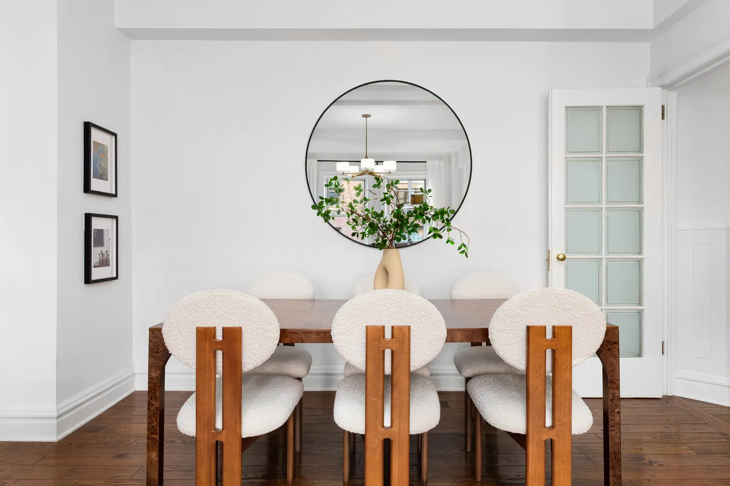 a table with chairs and painting on the table