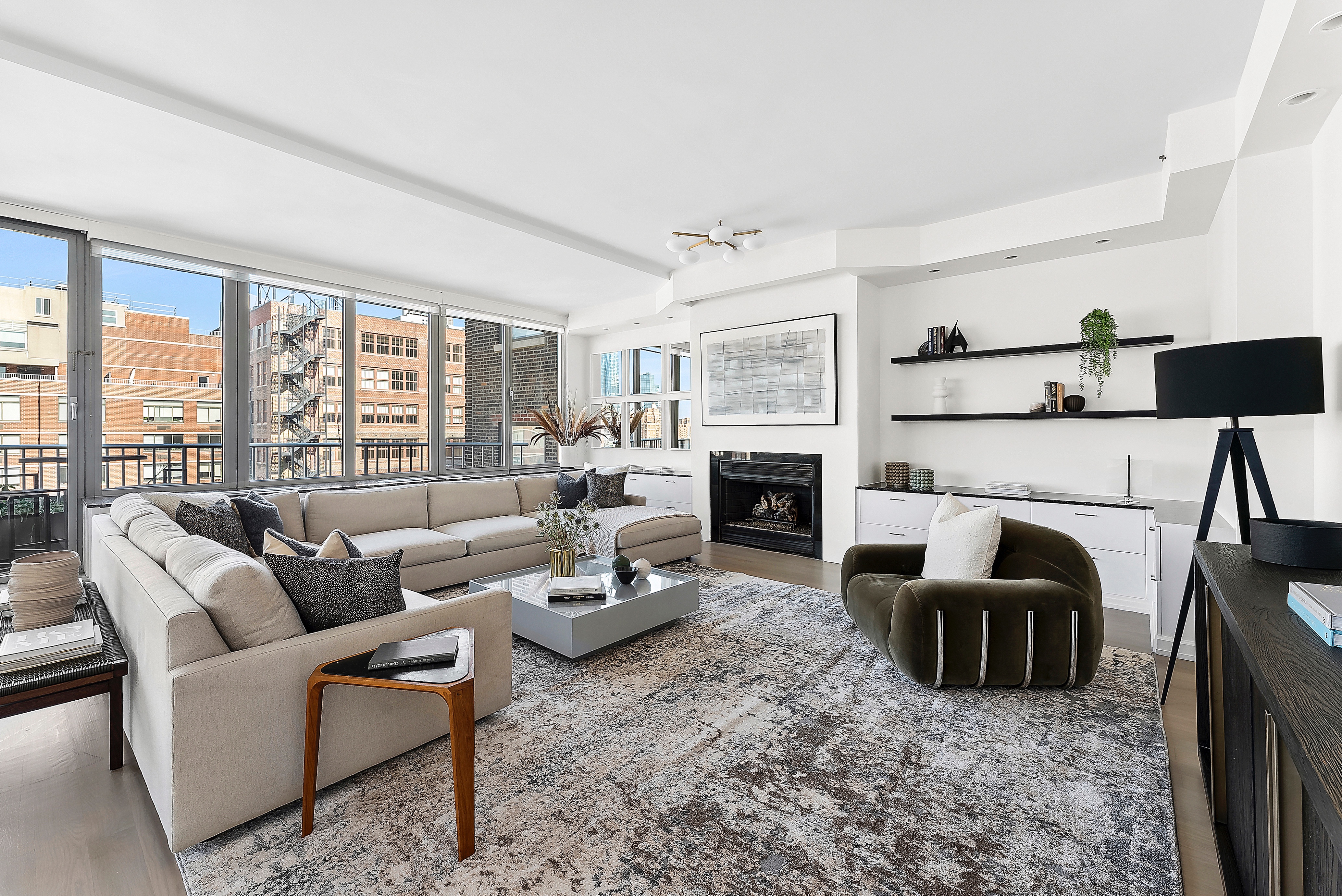 224 West 18th Street, Unit PHA Manhattan, NY 10011 - Photo 6 of 24 a living room with furniture and a fireplace