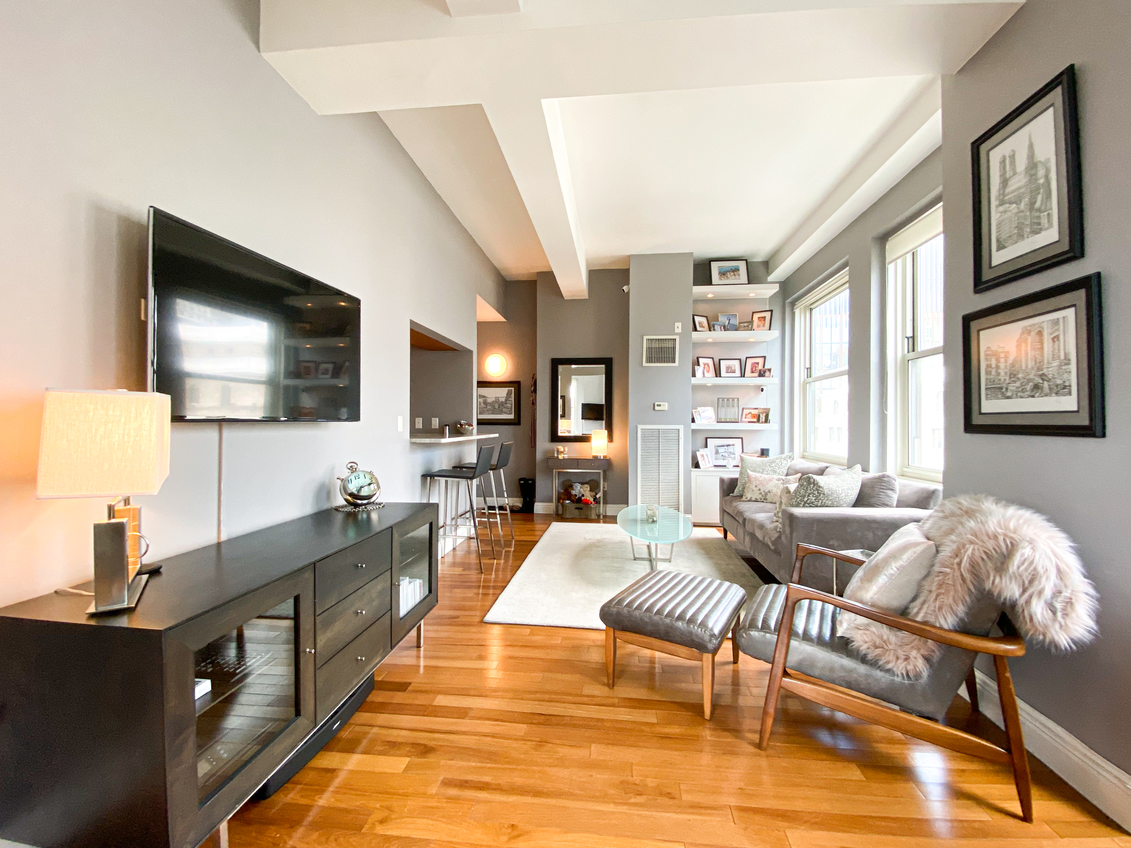 88 Greenwich Street, Unit 3005 Manhattan, NY 10006 - Photo 3 of 7 a living room with furniture wooden floor and flat screen tv
