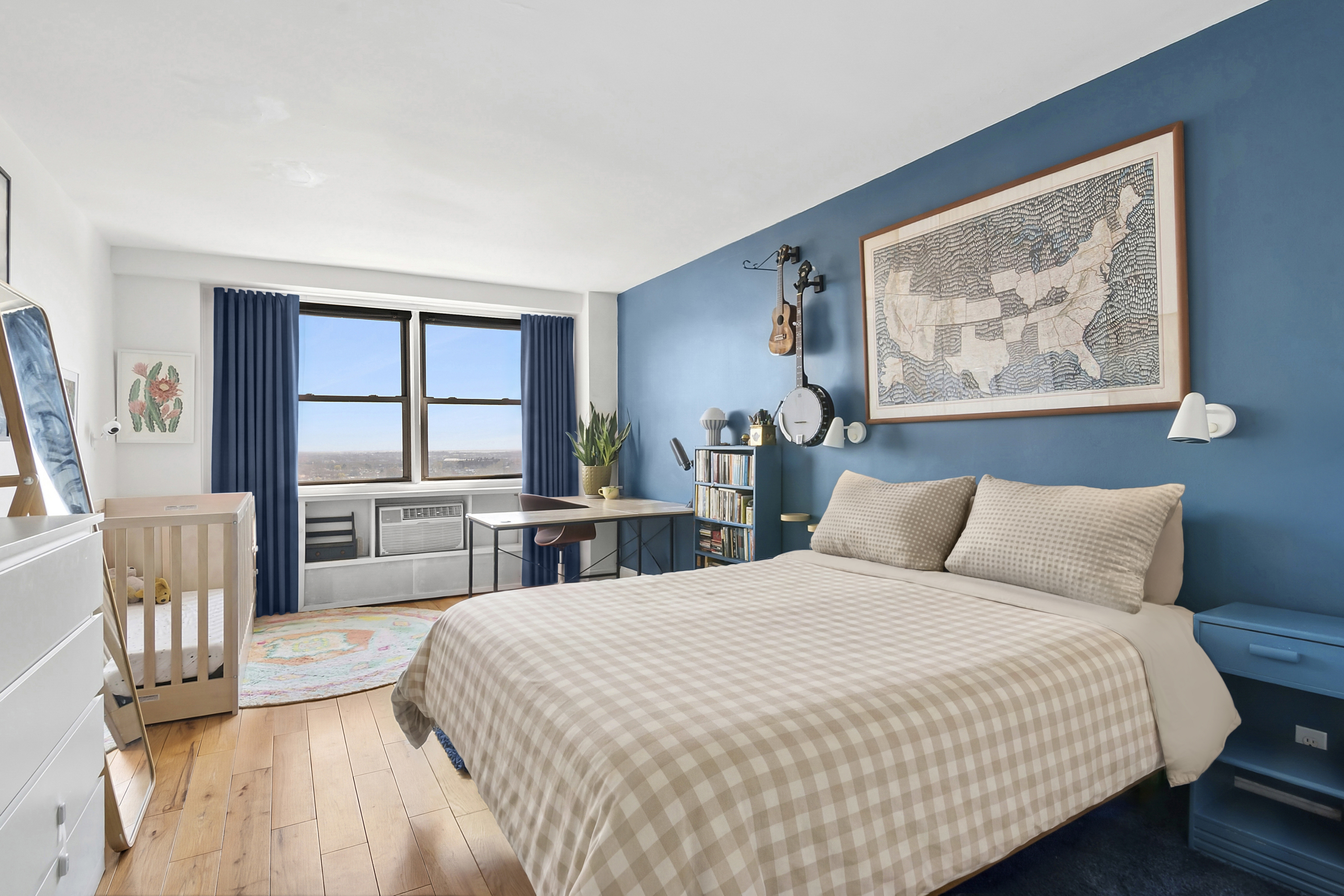 1655 Flatbush Avenue, Unit C1909 Brooklyn, NY 11210 - Photo 4 of 7 a bedroom with a large bed and a chandelier