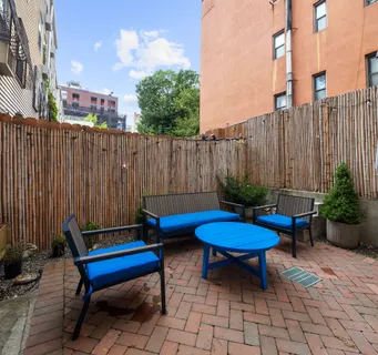 a view of a backyard with a patio