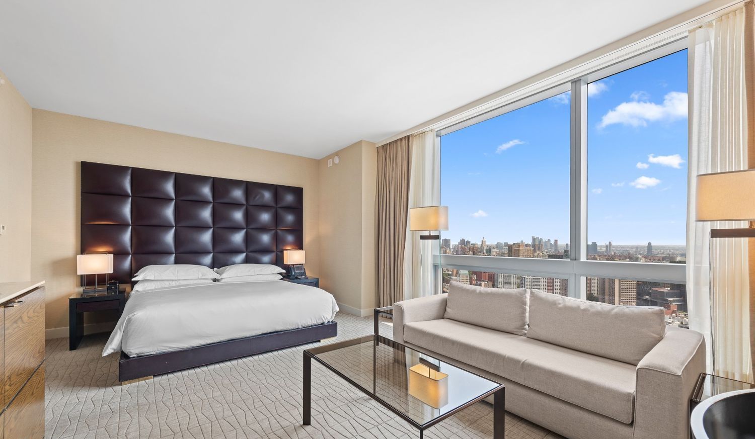 246 Spring Street, Unit 4111 Manhattan, NY 10013 - Photo 3 of 19 a bedroom with furniture and a large window