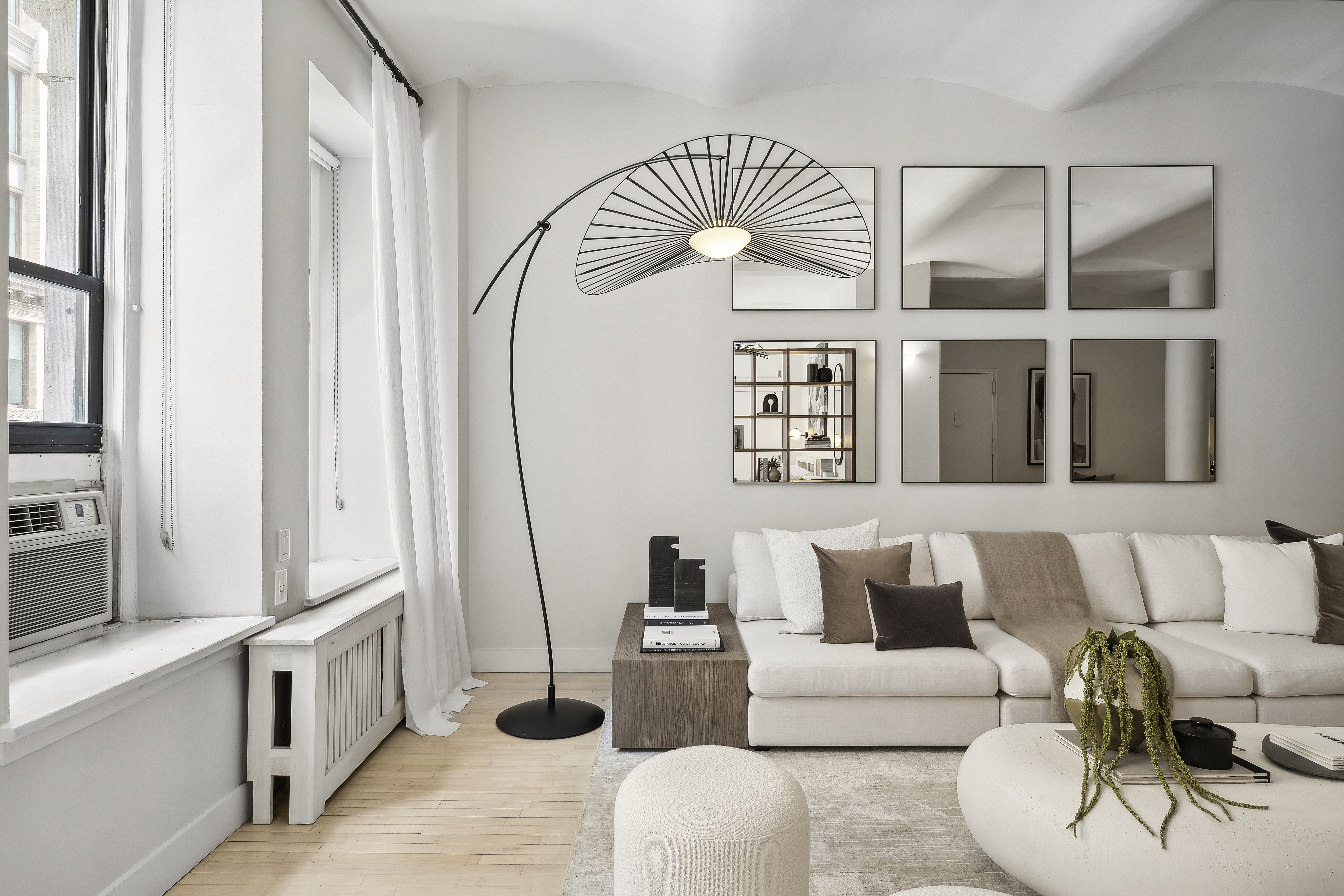 4 West 16th Street, Unit 4A Manhattan, NY 10011 - Photo 2 of 11 a living room with furniture and wooden floor
