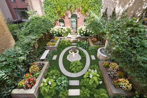 an aerial view of a house with garden space sitting space and swimming pool