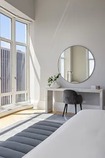 a view of a livingroom with furniture and a window