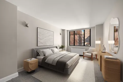 a spacious bedroom with a bed and glass windows