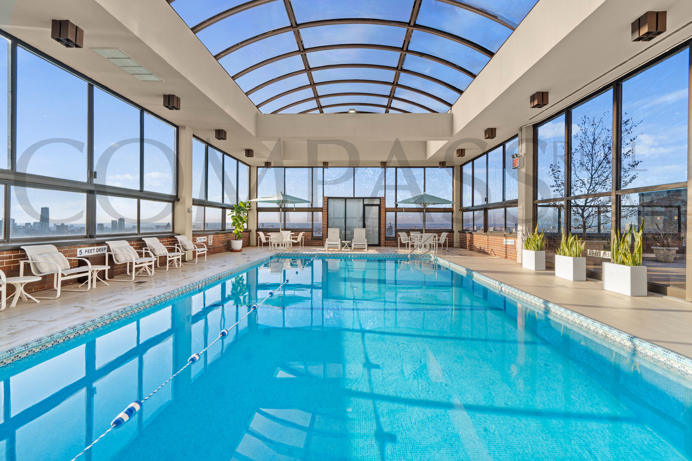 45 East 89th Street, Unit Undisclosed Manhattan, NY 10128 - Photo 8 of 10 a view of a swimming pool with seating area