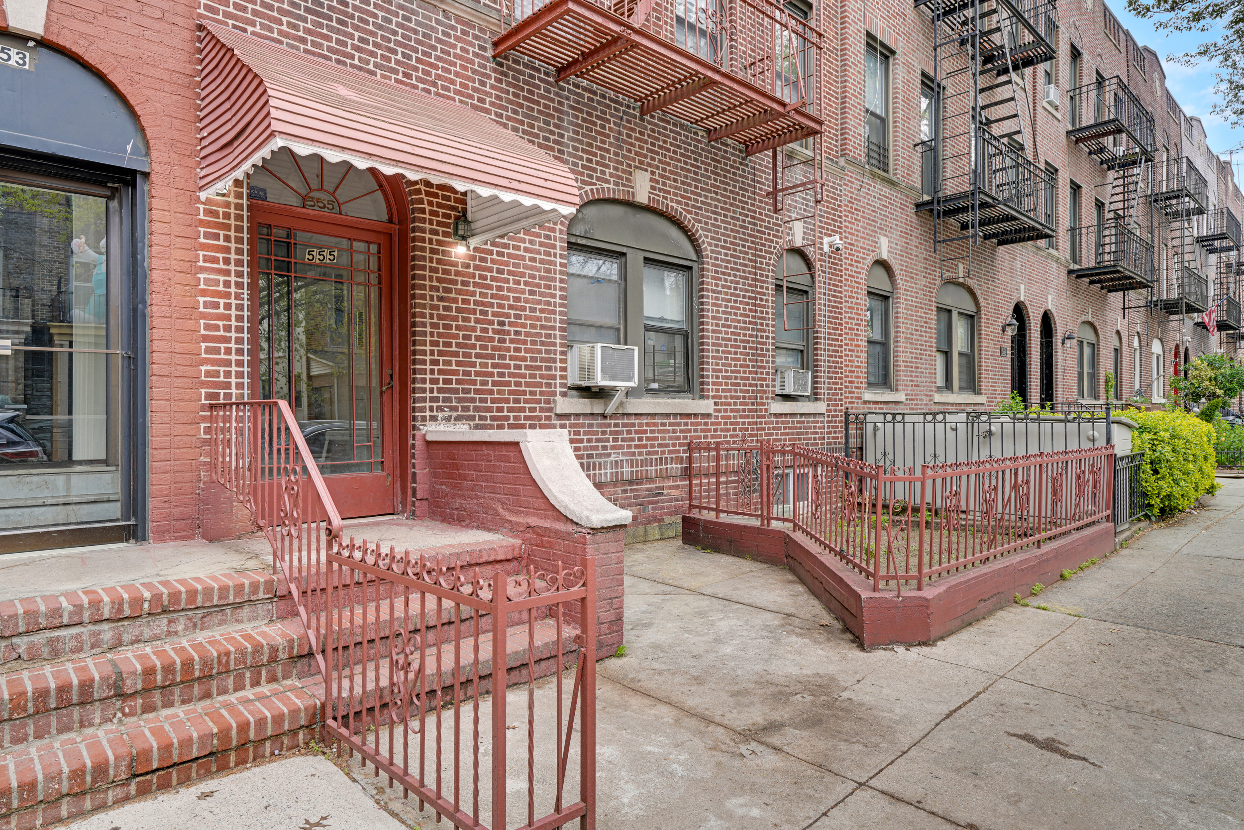 555 80th Street Brooklyn, NY 11209 - Photo 8 of 8 front view of a brick house with large windows
