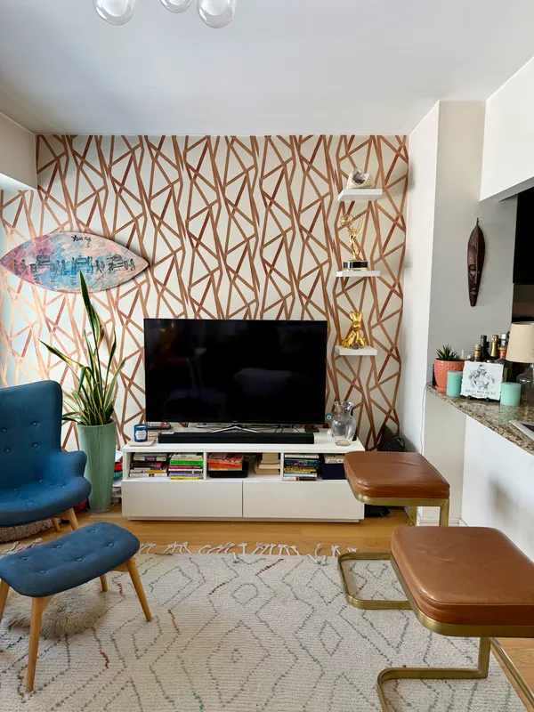 a living room with furniture and a flat screen tv