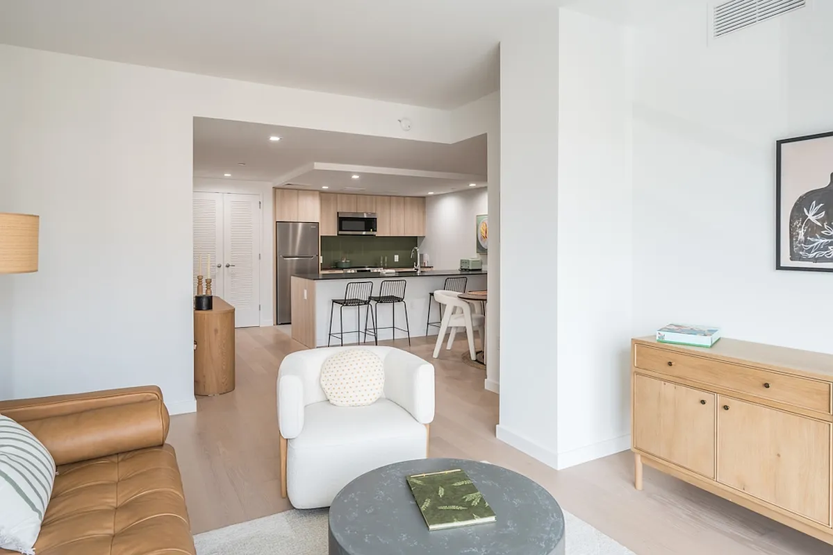 975 Nostrand Avenue, Unit 330 Brooklyn, NY 11225 - Photo 4 of 21 a living room with furniture and a wooden floor