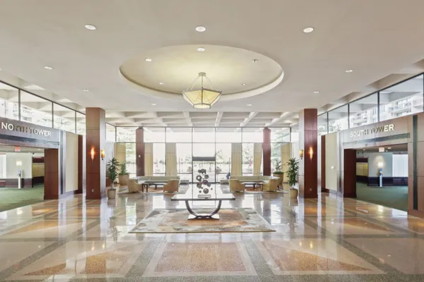 a view of a lobby with black carpet