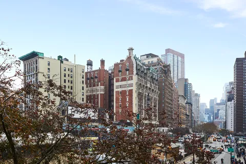 a view of a city with tall buildings in the background