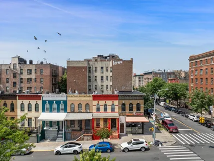 a front view of a building with street view