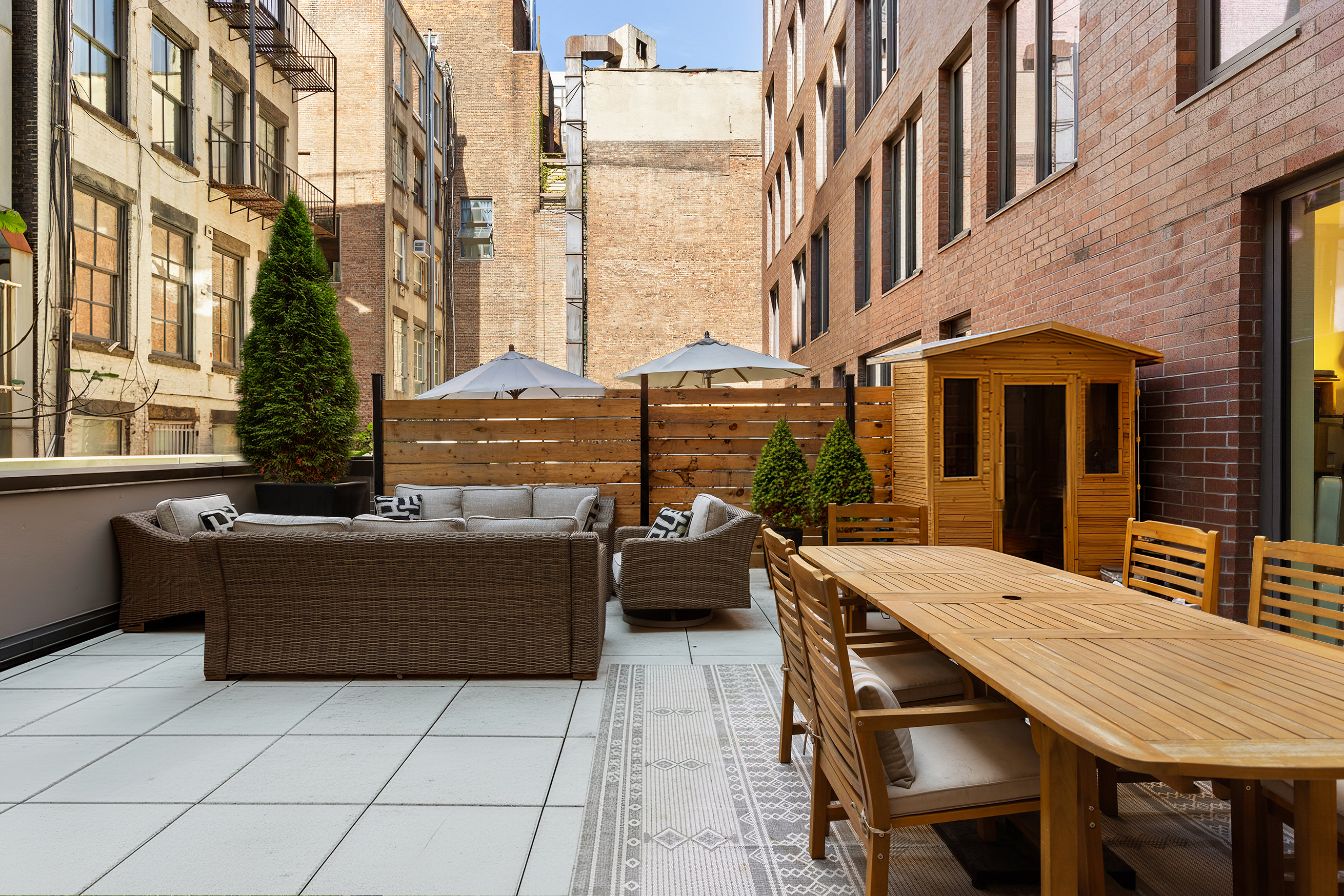 210 Lafayette Street, Unit 2D Manhattan, NY 10012 - Photo 13 of 14 a view of a patio with a table and chairs