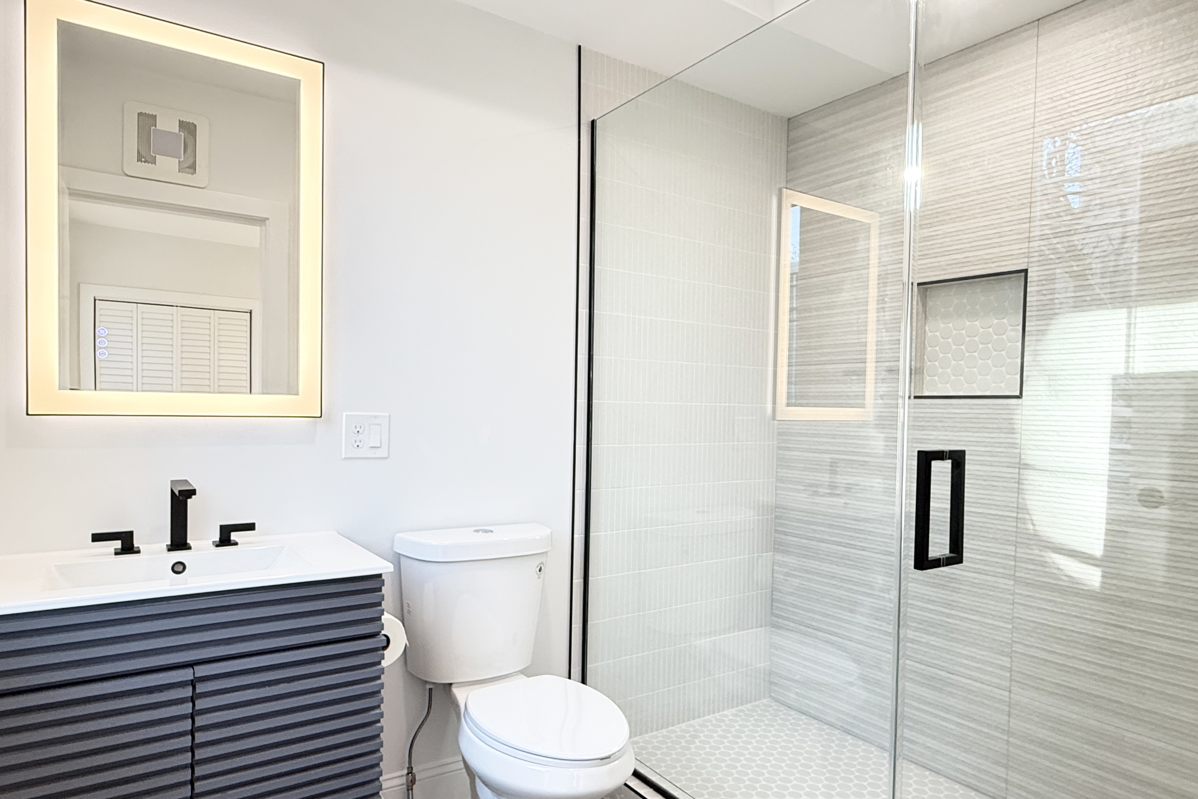 76 Webster Street East Boston, MA 02128 - Photo 5 of 8 a bathroom with a sink a toilet and shower