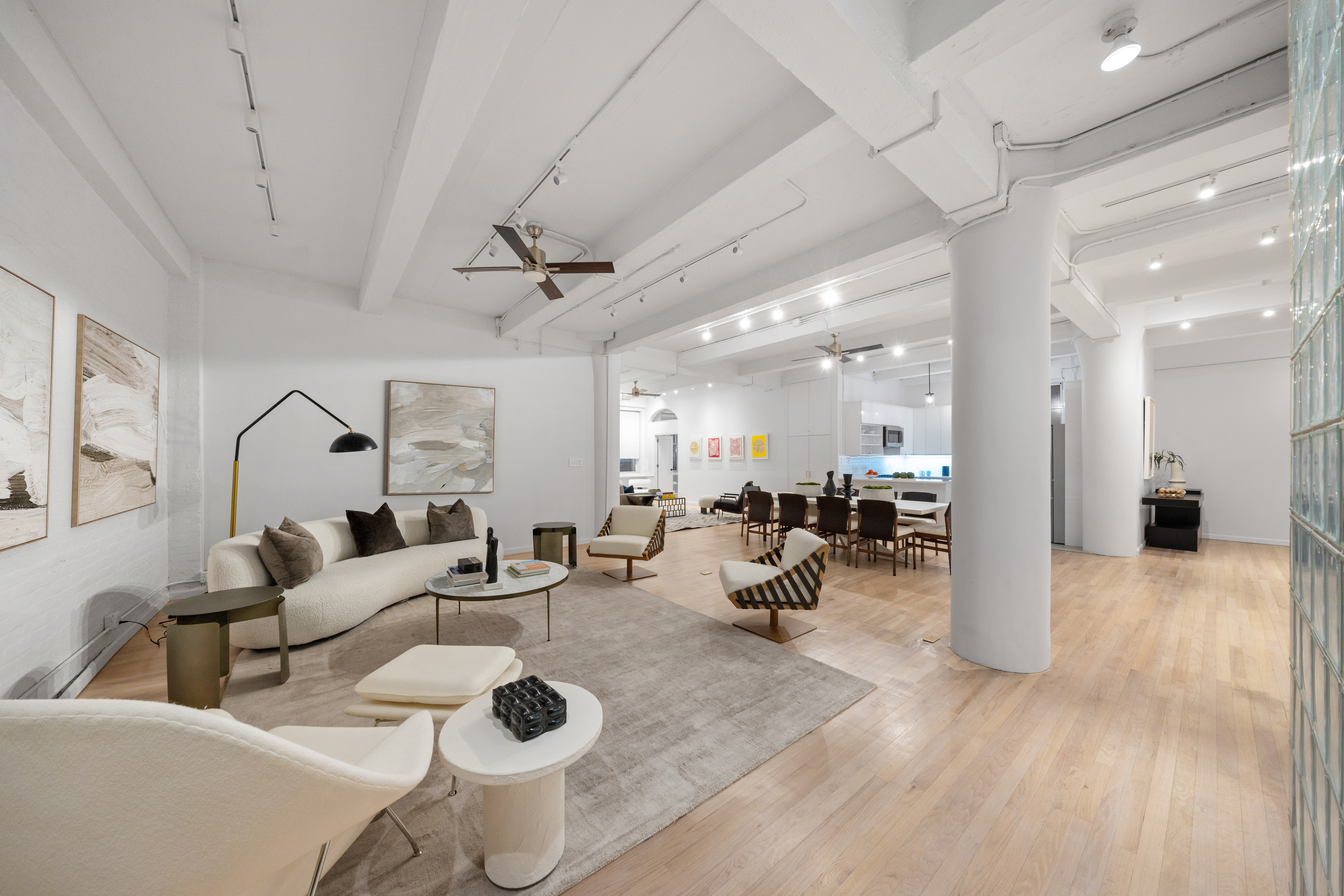 95 Vandam Street, Unit 2R Manhattan, NY 10013 - Photo 2 of 21 a living room with furniture and wooden floor