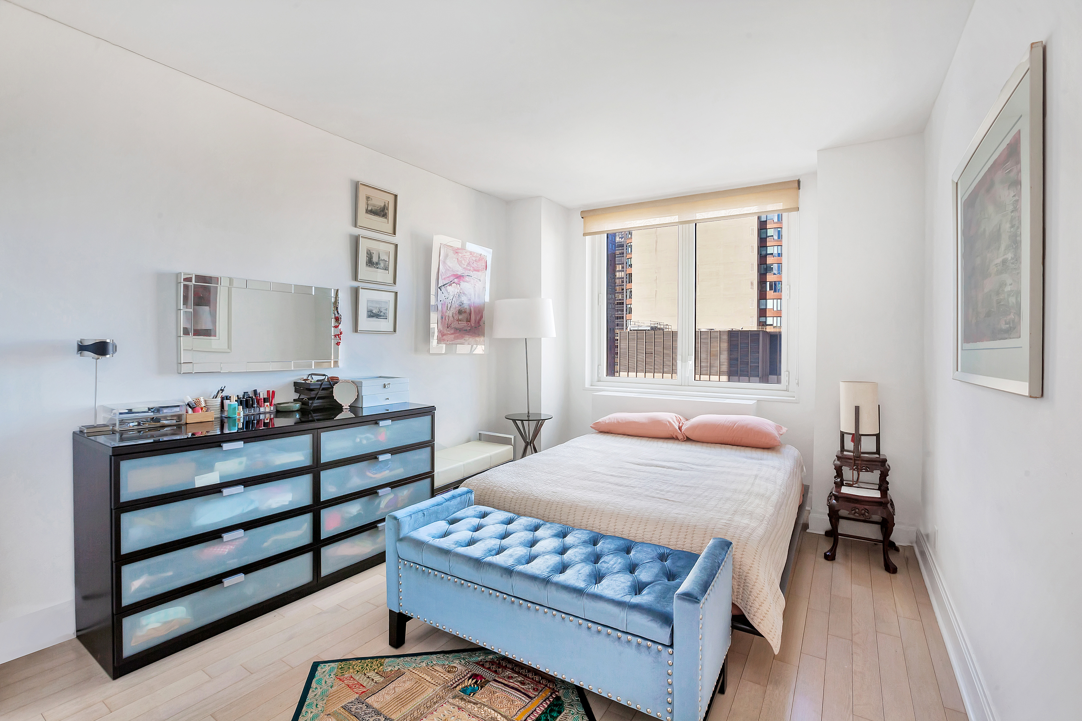 212 East 47th Street, Unit PHB Manhattan, NY 10017 - Photo 4 of 6 a bedroom with a bed and a window