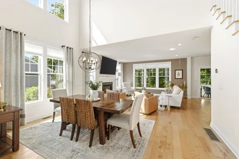 a view of a dining room with furniture window and outside view