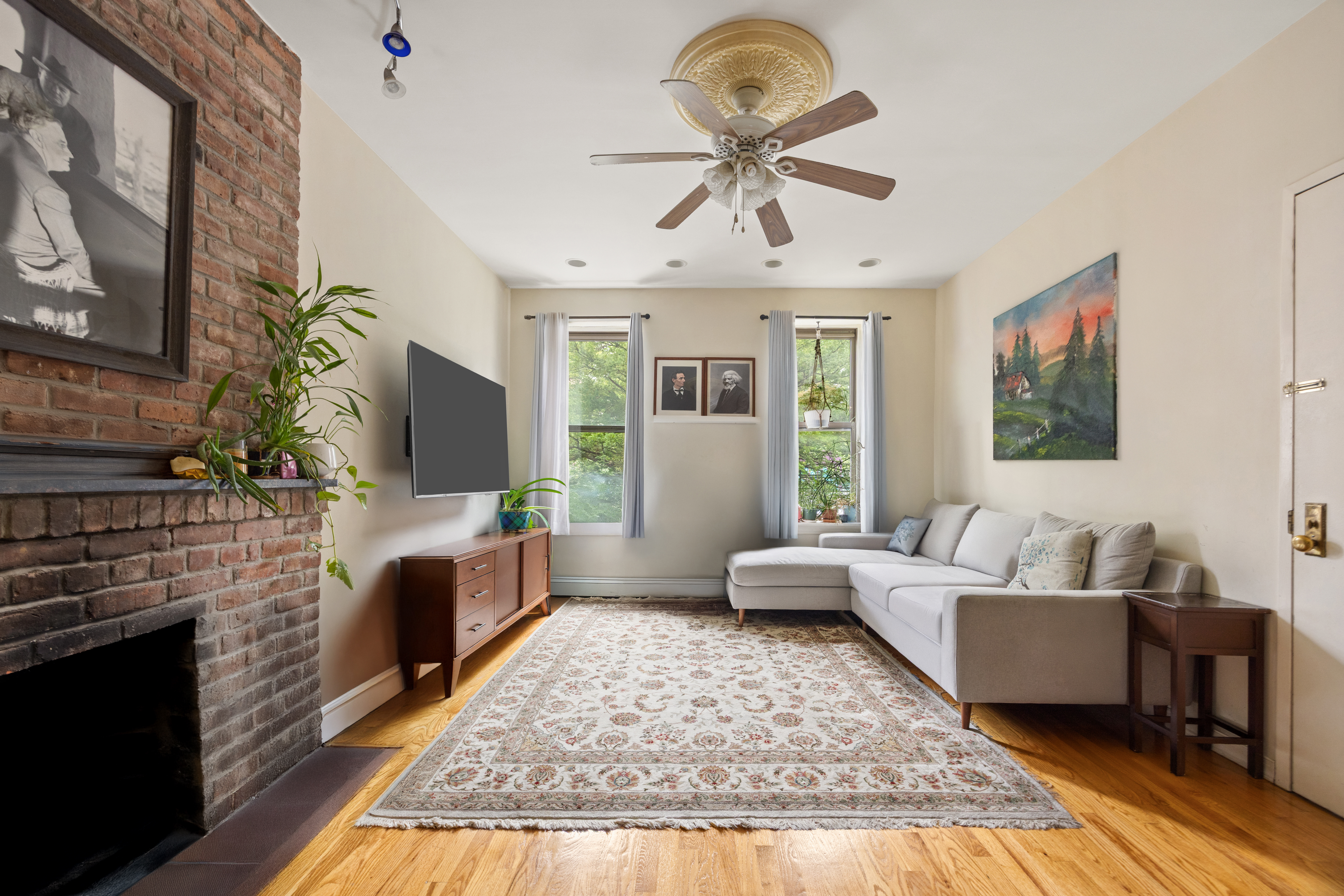 353 Warren Street Brooklyn, NY 11201 - Photo 1 of 10 a living room with furniture and a fireplace