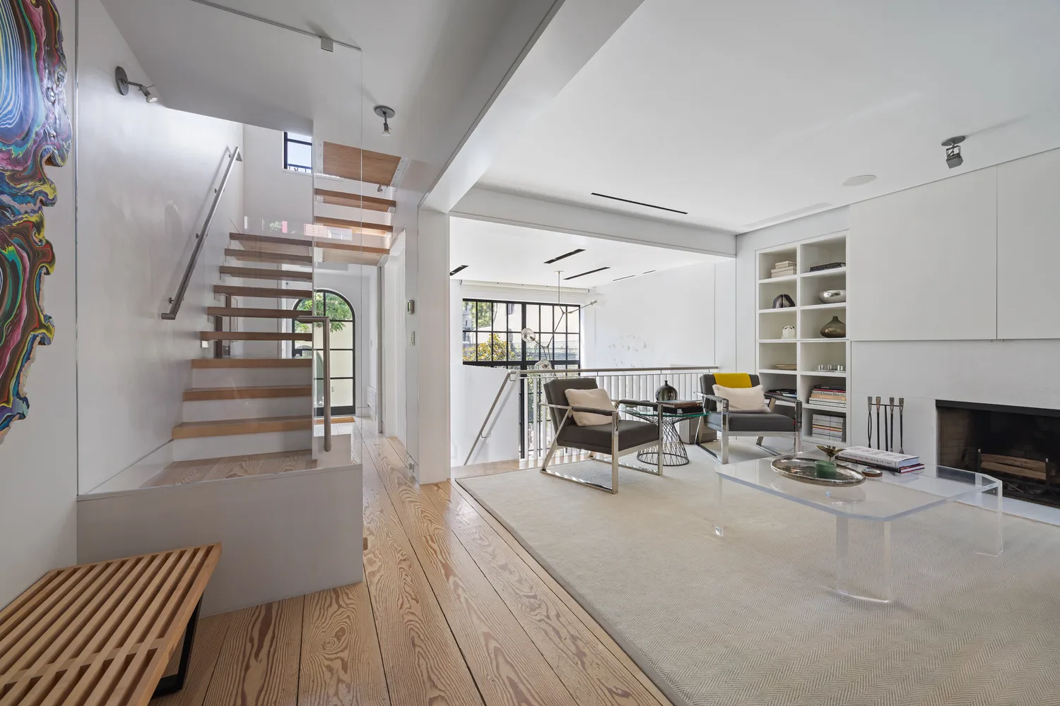 a view of a livingroom with furniture and fireplace