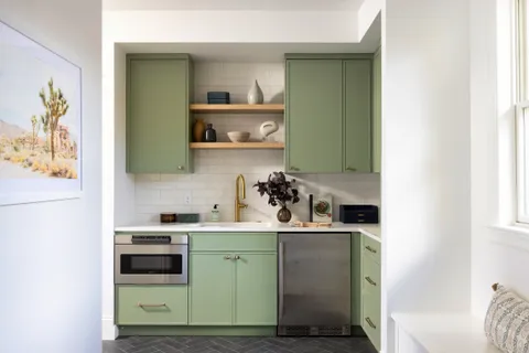 a room with a cabinets and a wooden floor
