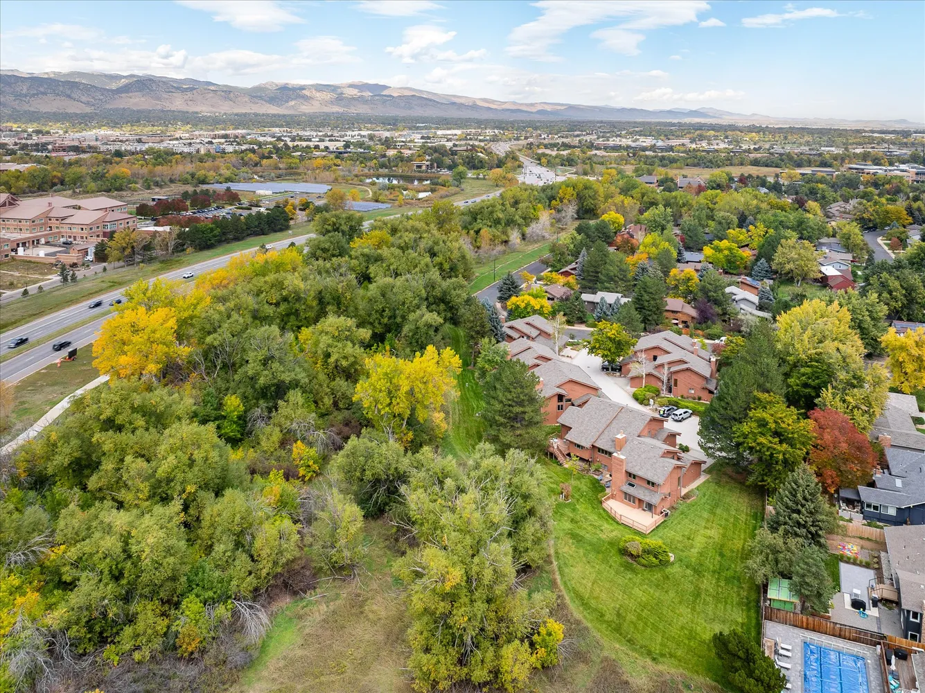 an aerial view of residential houses with outdoor space