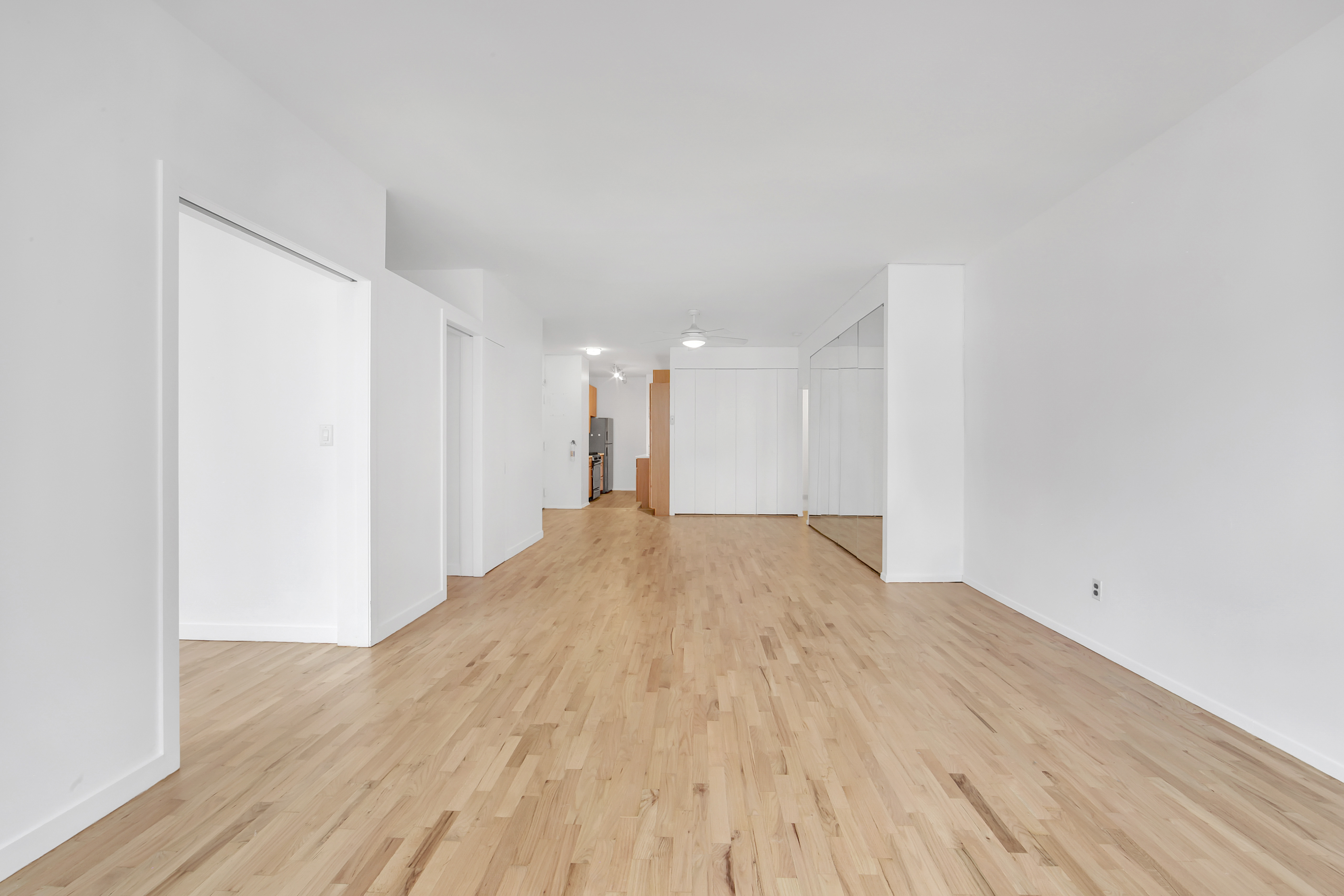 75 Livingston Street, Unit 9B Brooklyn, NY 11201 - Photo 8 of 13 a view of empty room with wooden floor