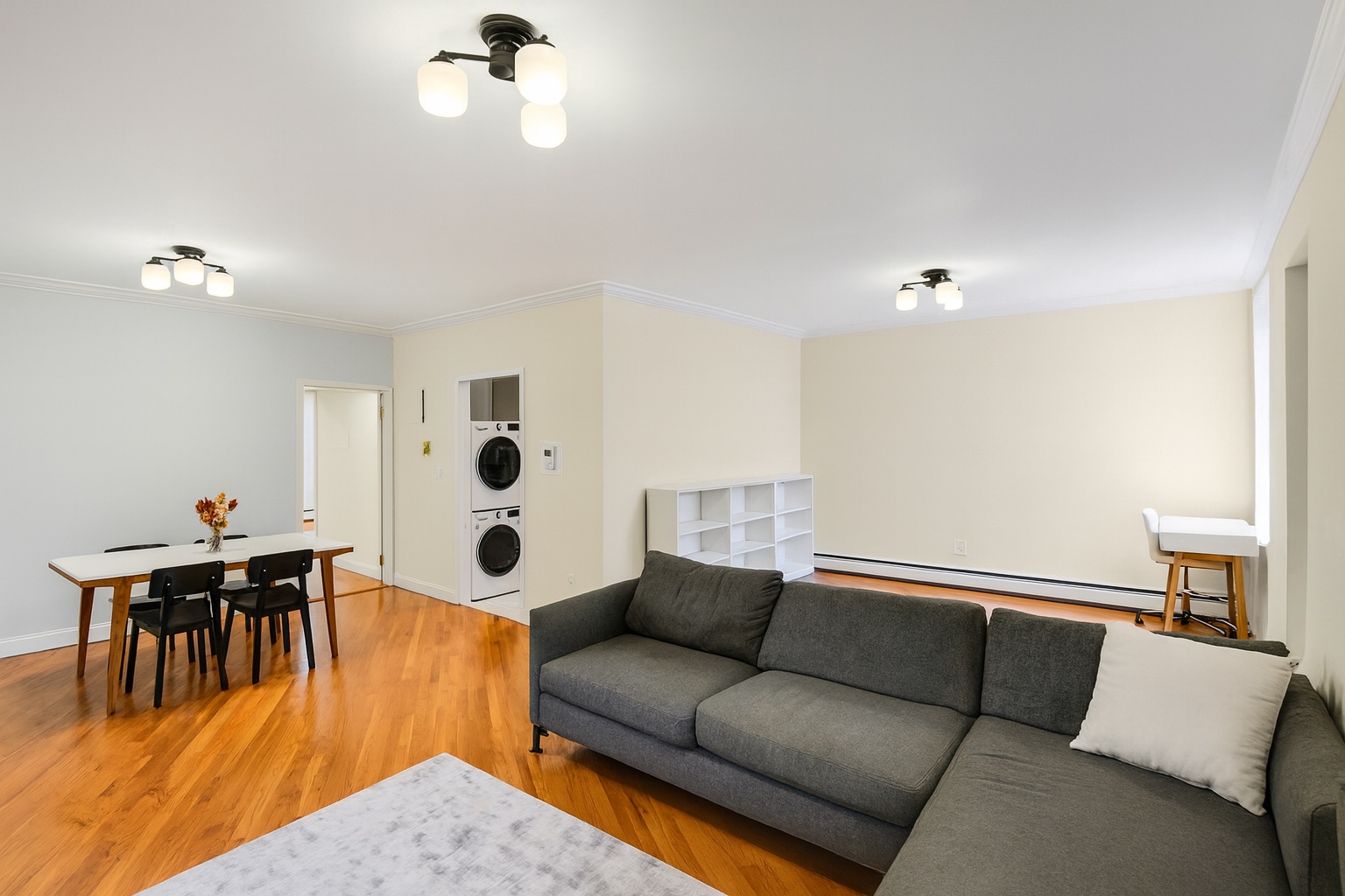 120 2nd Avenue, Unit 5A Manhattan, NY 10003 - Photo 2 of 10 a living room with furniture and wooden floor