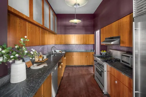 a kitchen with a sink and cabinets
