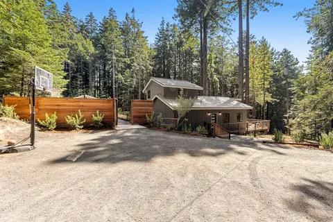 a view of a outdoor space with patio and trees