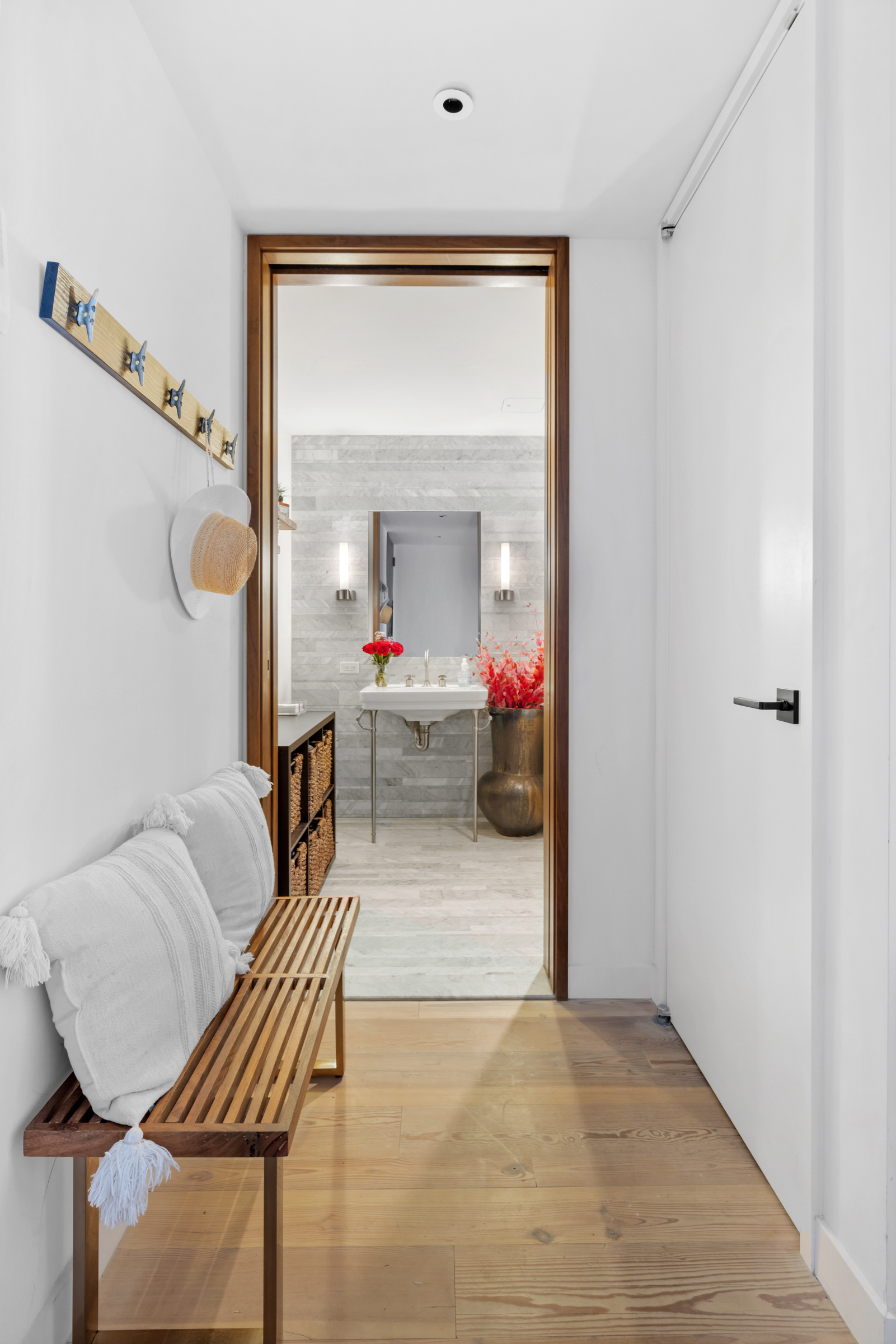 90 Furman Street, Unit N609 Brooklyn, NY 11201 - Photo 13 of 28 a living room with furniture and a mirror